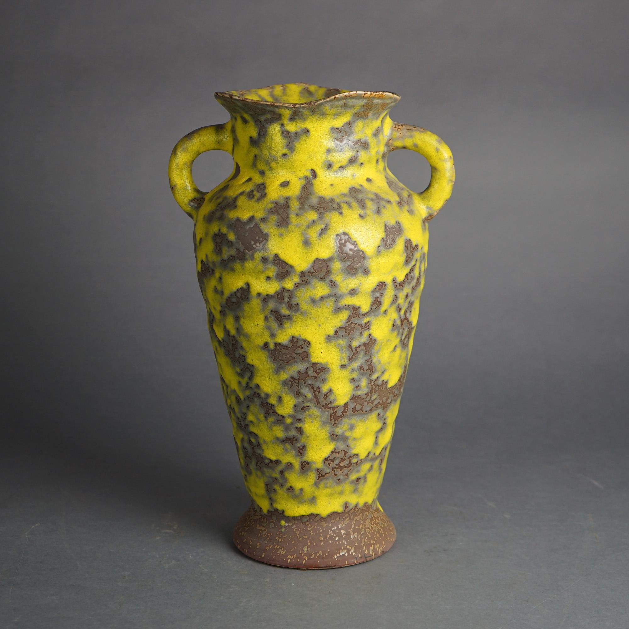 Mid Century Modern Haeger Lemon Peel Art Pottery Double Handled Vase with Ruffled Rim, 20thC

Measures -  15.75
