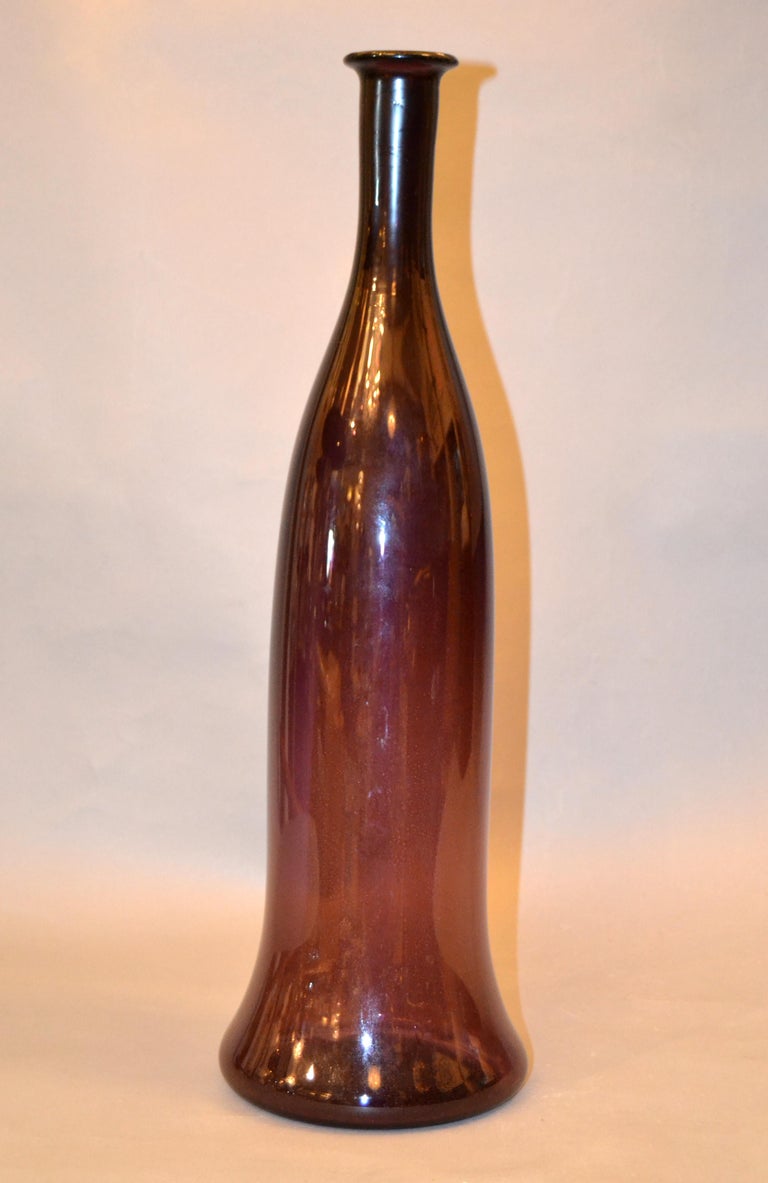 Mid-Century Modern tall blown glass vase, vessel, decanter in translucent amethyst purple.
Amethyst purple is a shade that captivates the imagination and inspires.
This vase is perfect for your home or family gathering.