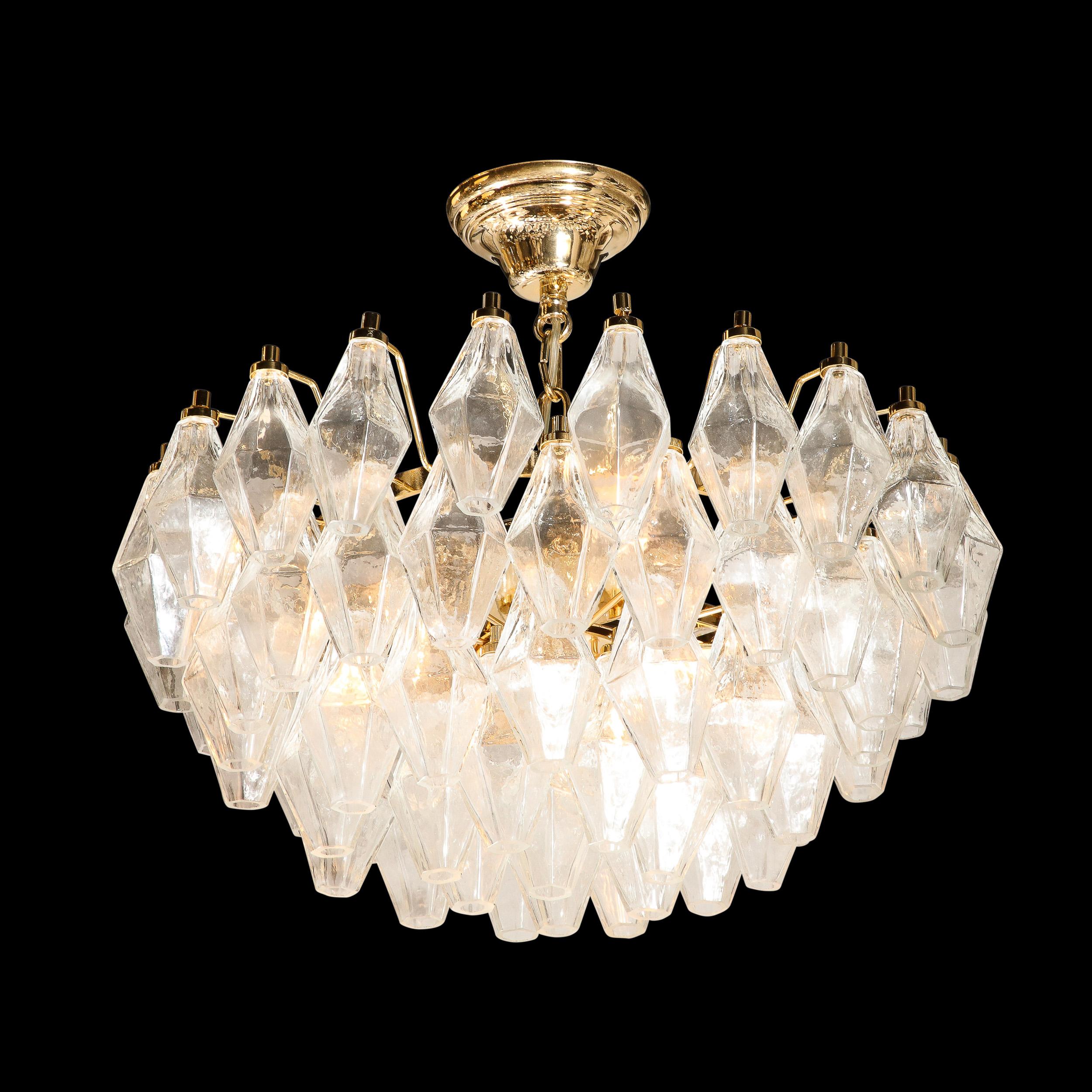 This exceptional Mid-Century Modern polyhedral chandelier was realized in Murano, Italy- the island off the coast of Venice renowned for centuries for its superlative glass production. It offers an abundance of handblown Murano translucent glass