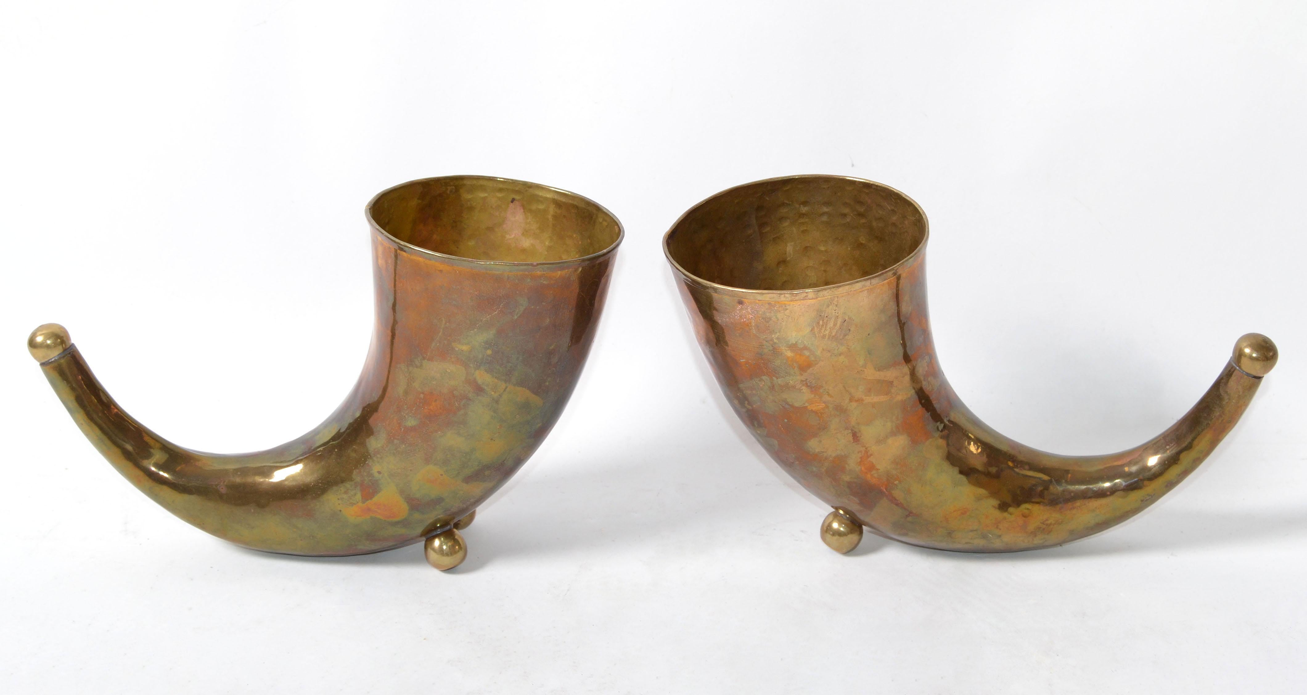 Mid-Century Modern handcrafted & hammered brass horn sculptures or bookends in original condition with age related patina.
Very well made craftsmanship.

 