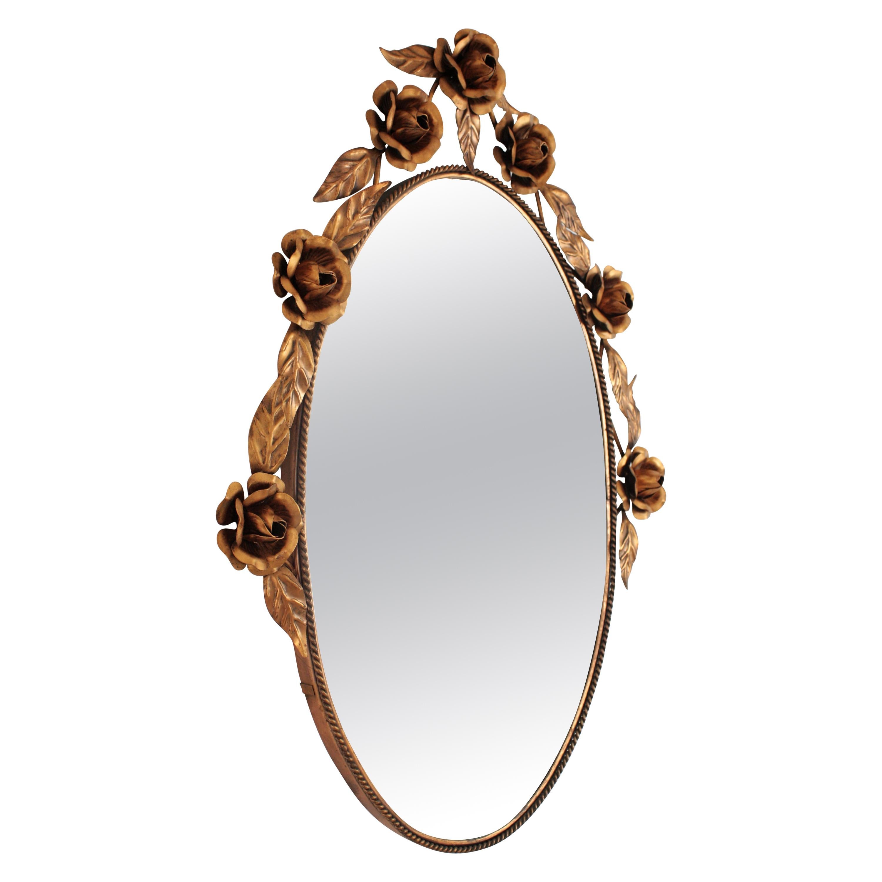 Mid-century Modern Floral Foliage Oval Mirror in Copper, Spain, 1960s
Eye-catching hand-hammered oval mirror with metal coppered floral crest. 
The crest of roses and leaves adorning the top makes this piece highly decorative. Beautiful to place in