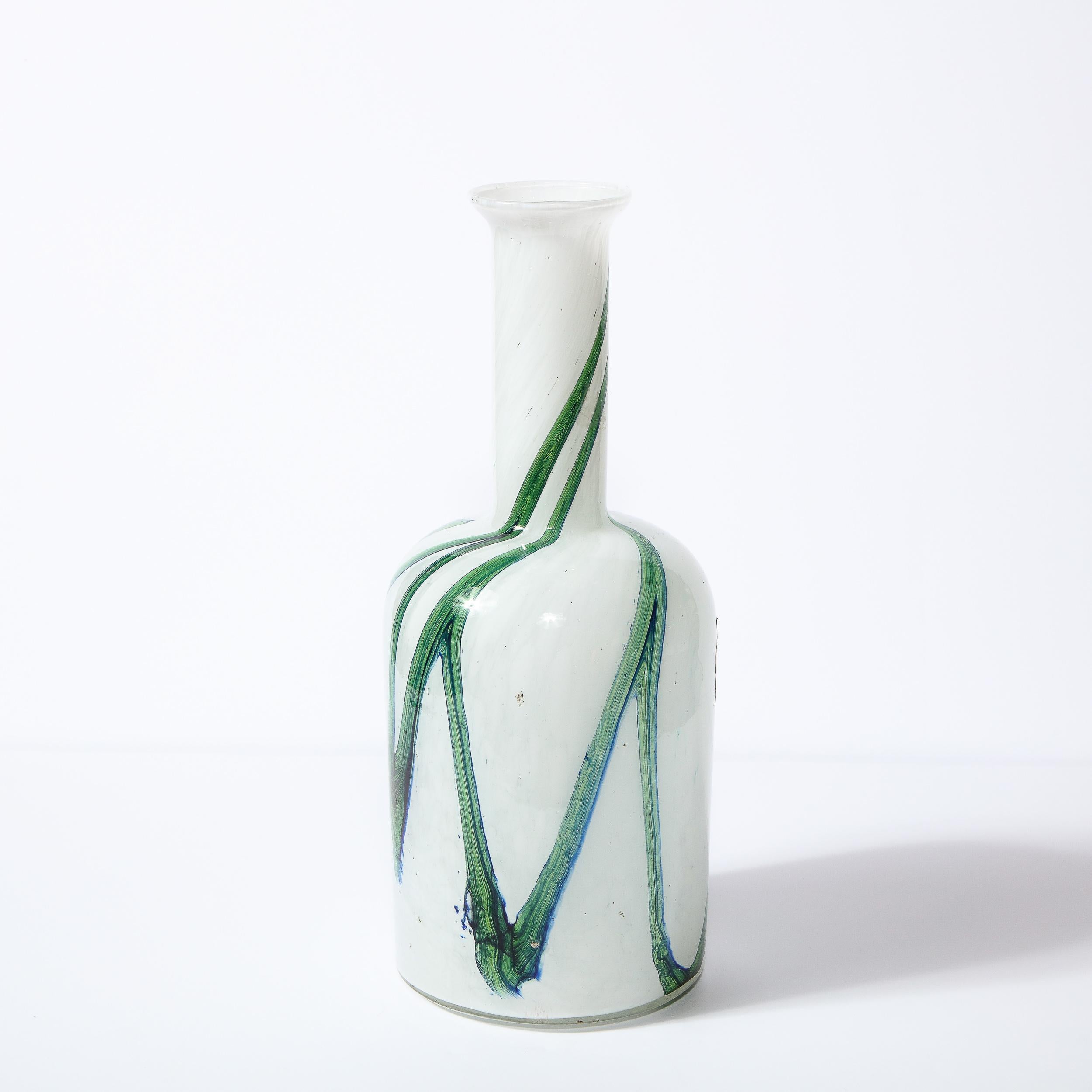 This stunning Scandinavian Mid-Century Modern vase was designed by the esteemed Otto Brauer and for Holmegaard, and handblown in Murano, Italy, circa 1960. The piece features a cylindrical body with curved shoulders that ascends into a slender