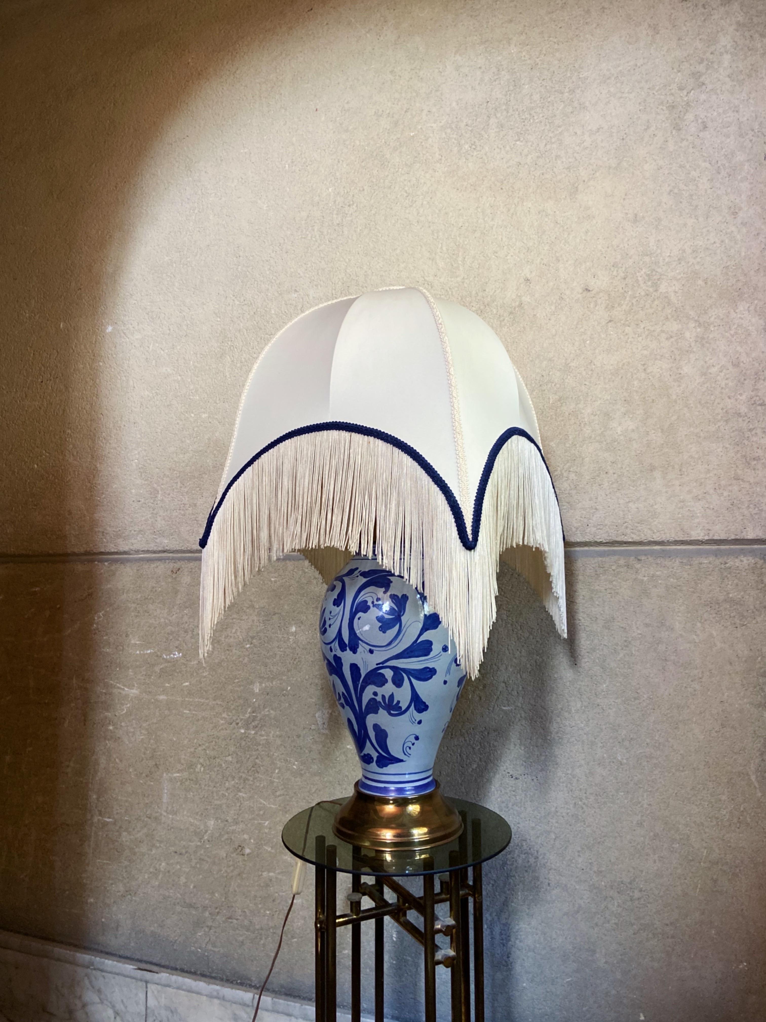 Italian ceramic table light. Sold with lamp shade.

Details
Dimensions: Light base is 55 cm. Height with shade 78 cm.
Materials and Ceramic, brass, fabric.
Place of Origin: Italy
Period 1970-1979
Condition: In good vintage condition. The
