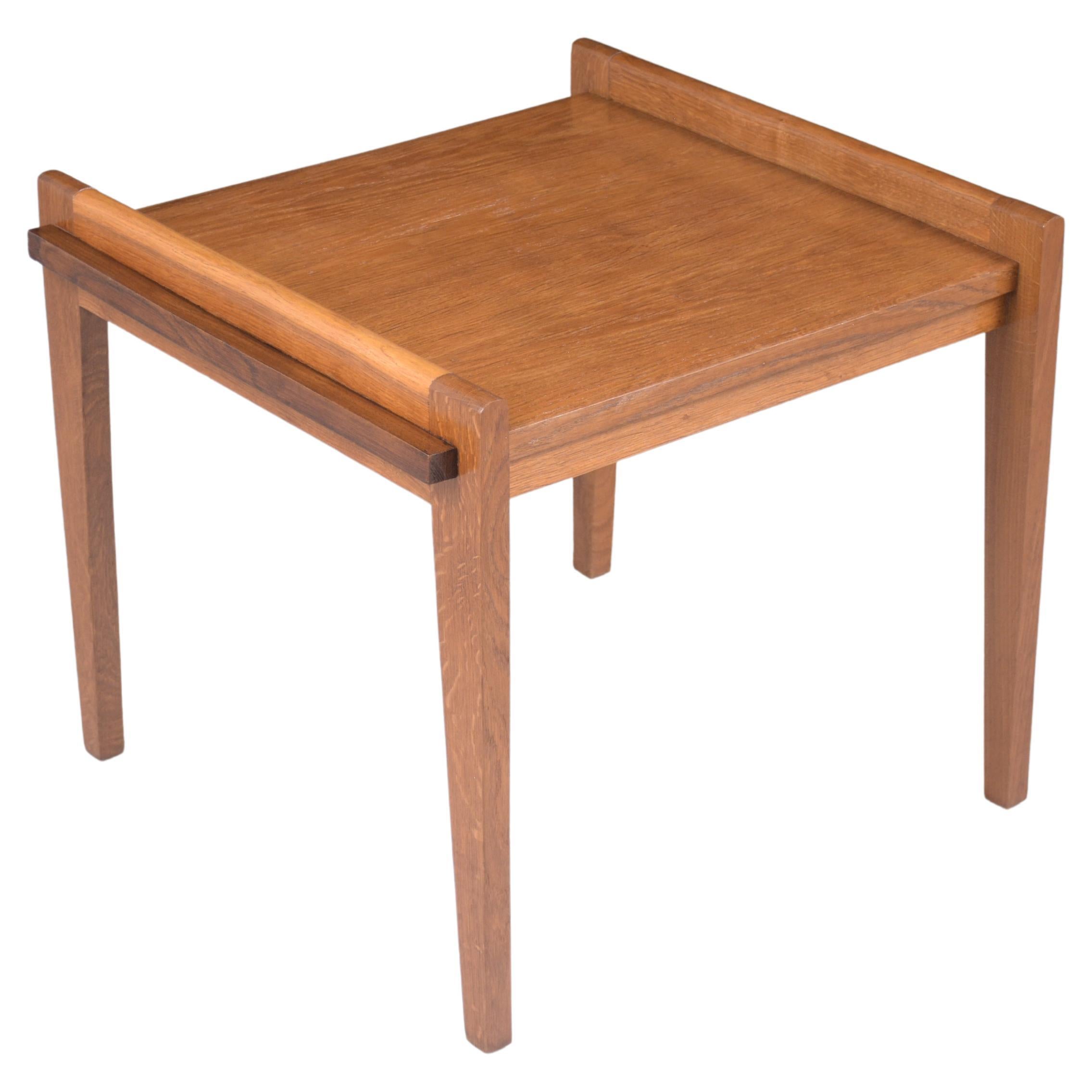 An extraordinary danish modern bedside table hand-crafted out of teak wood in great condition and has been completely restored by our professional craftsmen team. This mid-century side table is sleek and features a natural and brown stain color