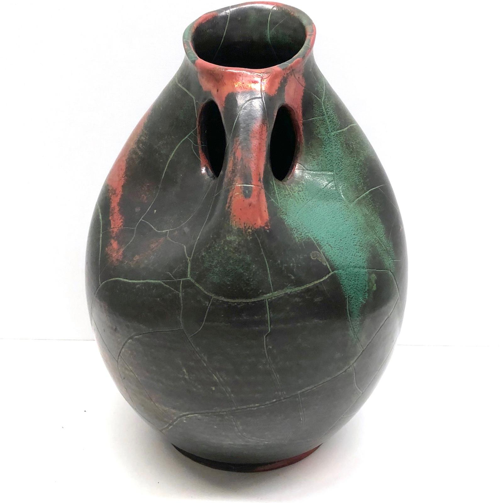 An amazing midcentury art pottery vase made in Germany, circa 1950s. Extremely nice exterior, marked. Vase is in very good condition with no chips, cracks, or flea bites.