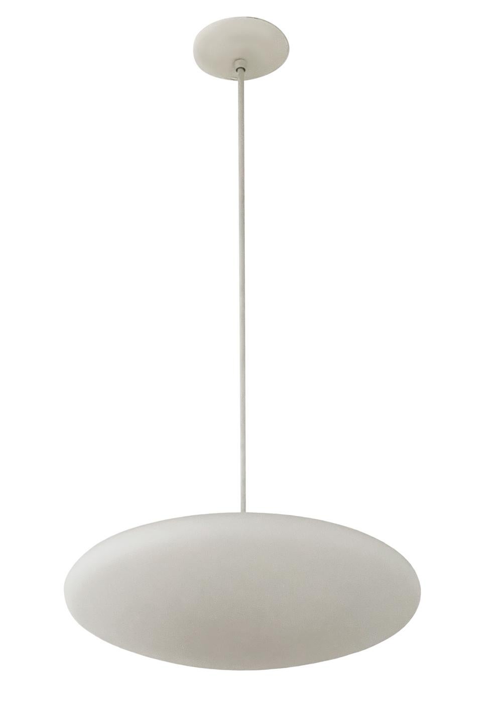 A simple Classic modern pendant lamp circa 1960s. These hang 38 inches from the ceiling, length is not adjustable. Sold as a pair.