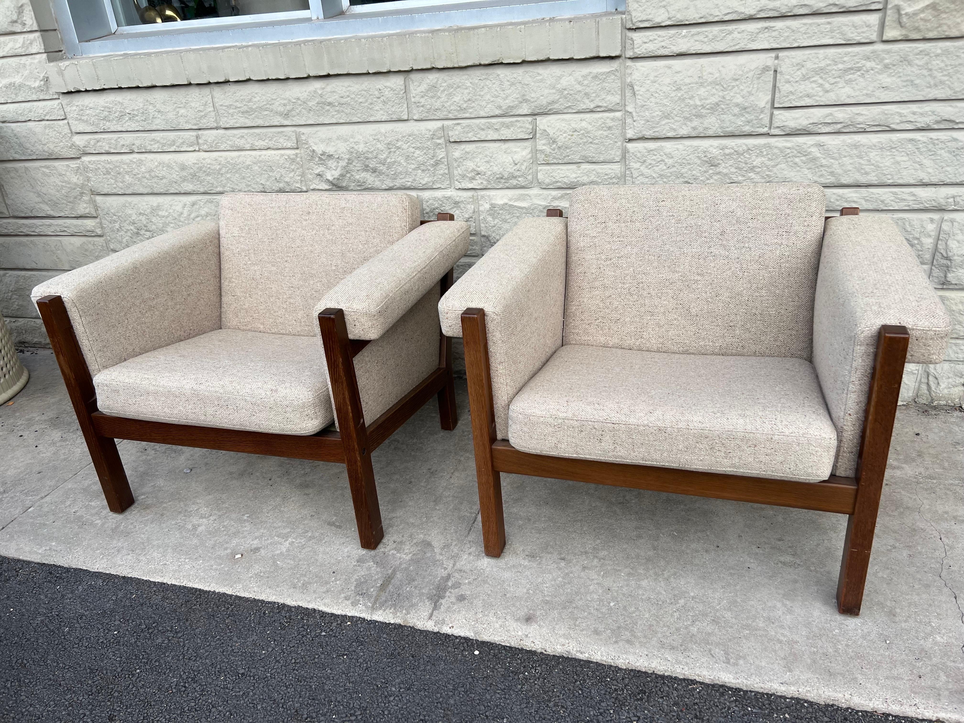 Mid-Century Modern Hans Wegner lounge armchairs GE-40 for GETAMA, Denmark, circa 1960s and solid oak. Fabric and frame are in great overall condition. Hans J. Wegner is considered to be a prolific designer of the 20th century. 
measurements: 36.25
