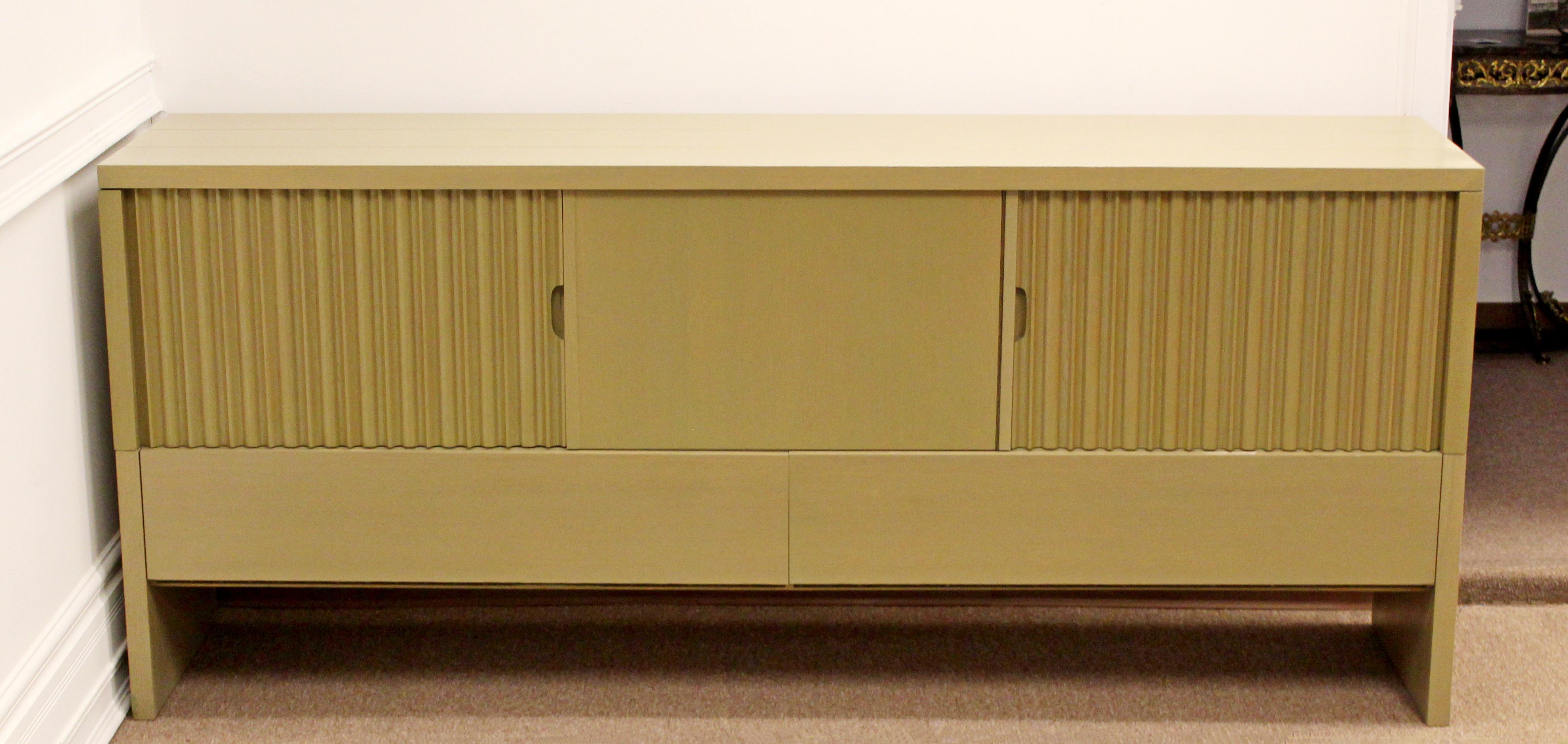 For your consideration is a magnificent credenza, with many storage openings and a butterfly joinery a bow-tie design, designed by Harold Schwartz for Romweber, circa early 1950s. In very good vintage condition. The dimensions are 84.5