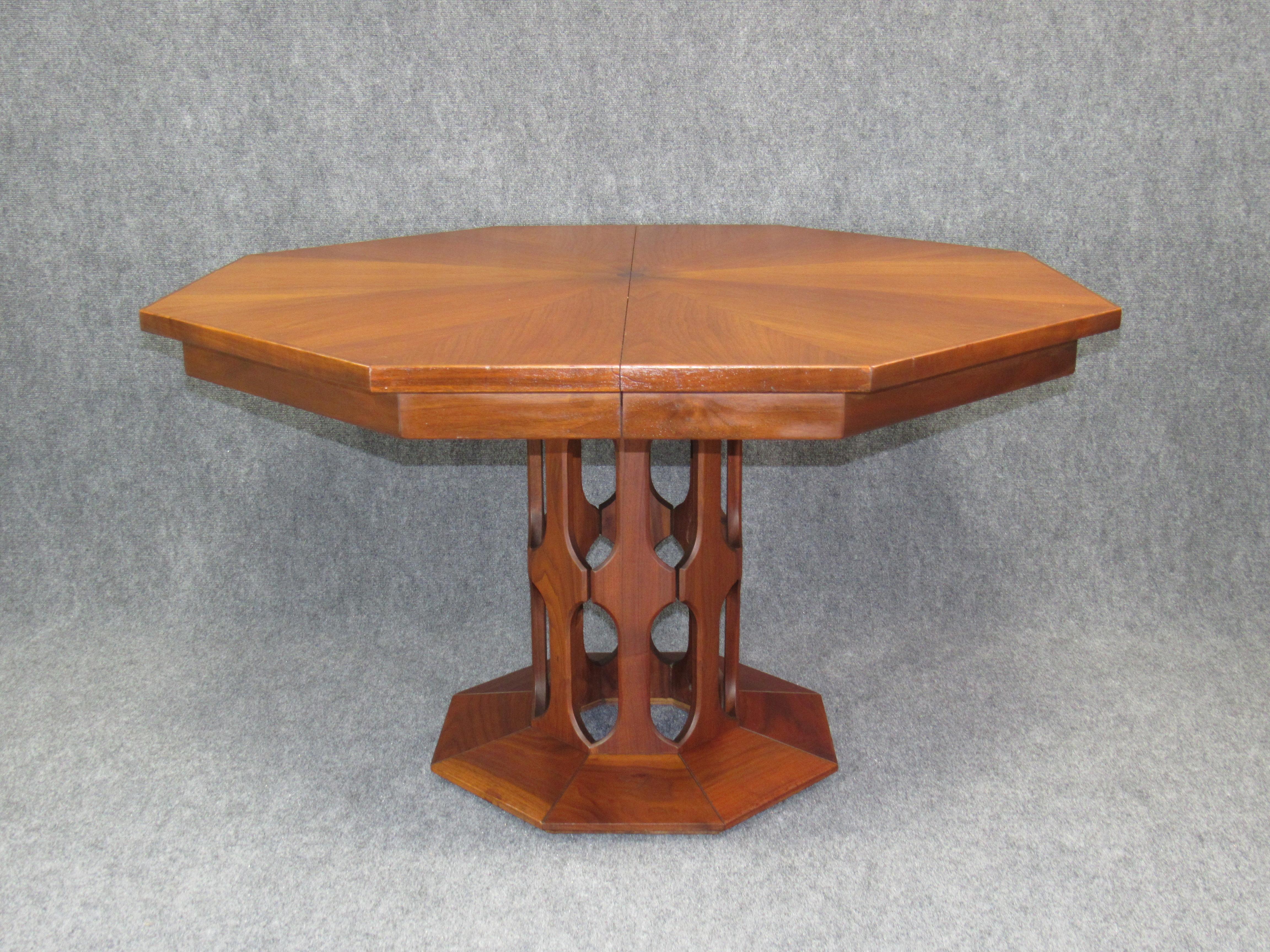 This Mid-Century Modern Harvey Probber octagonal dining extension table in walnut will be the centerpiece of any dining room or eating area. Exquisitely made and engineered by Harvey Probber with extraordinary level of detail. Fold-down solid walnut