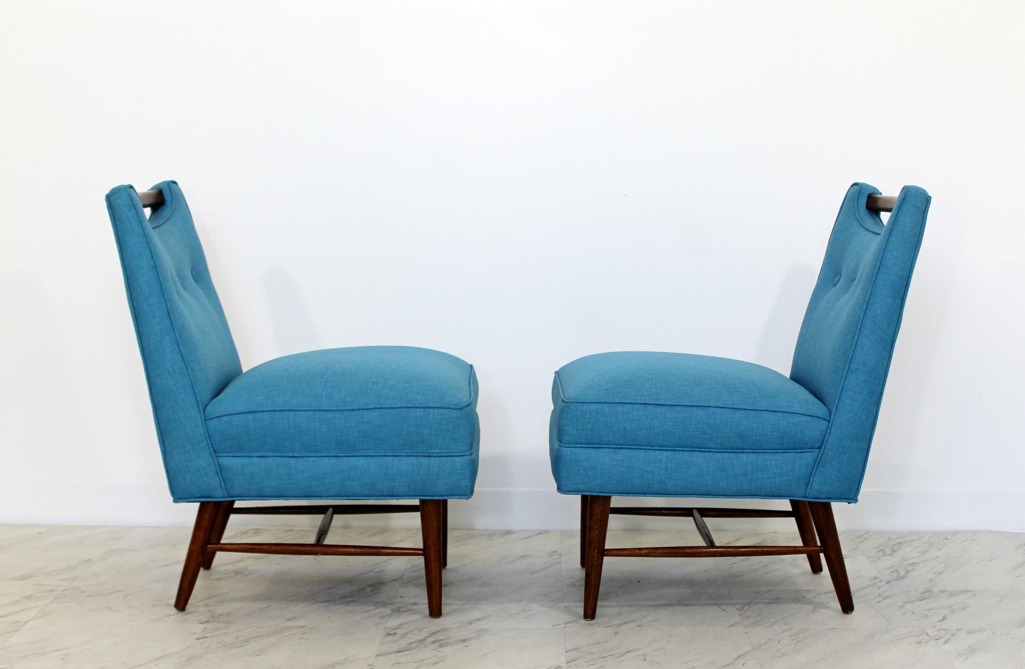 For your consideration is phenomenally impeccable, pair of slipper chairs, with wooden handles or pulls at the top of the back, by Harvey Probber, circa the 1950s. Just came back from being professionally reupholstered in a vintage Knoll fabric. In