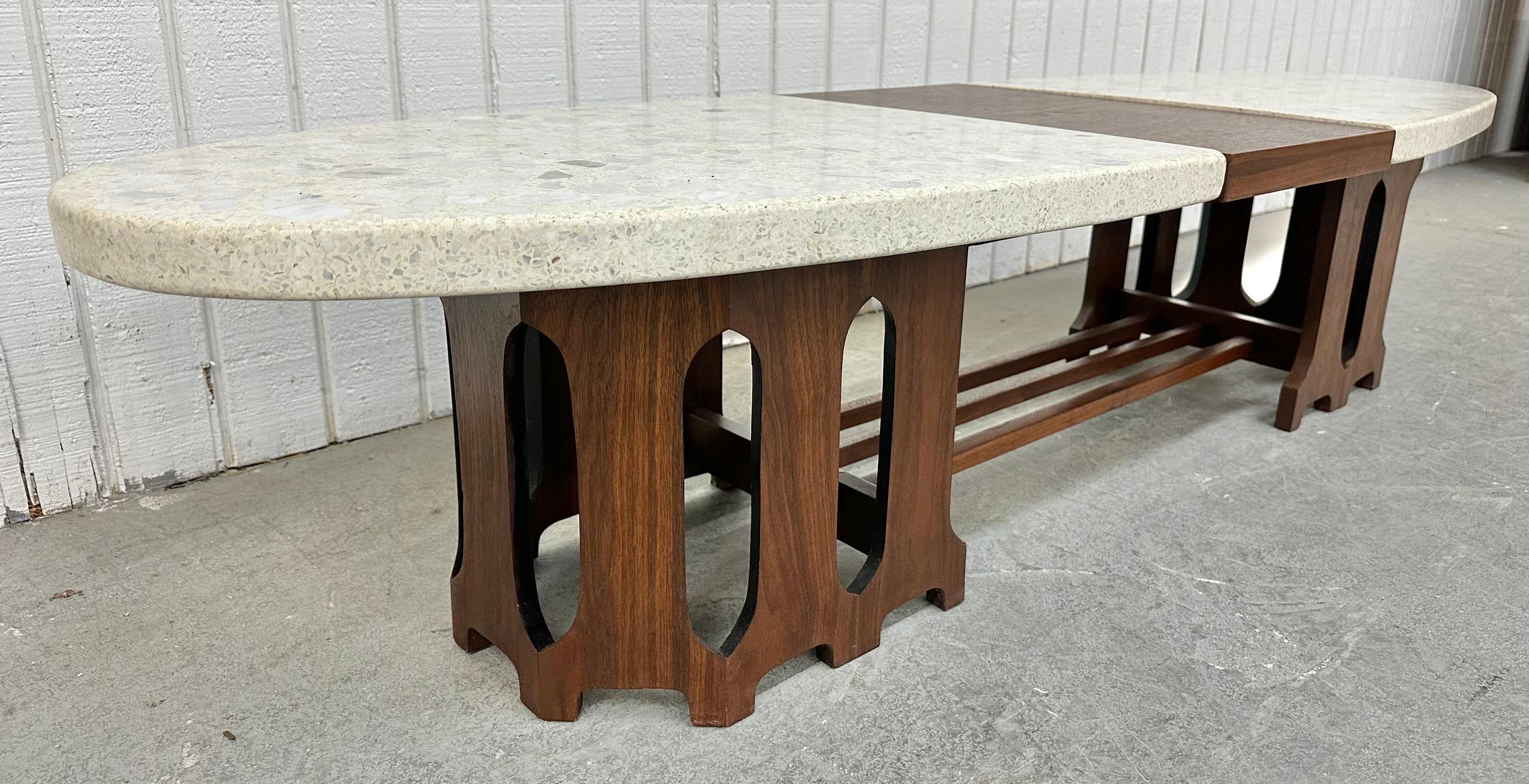 This listing is for a Mid-Century Modern Harvey Probber Terrazzo & Walnut Coffee Table. Featuring an oval design , removable white terrazzo stone on each side, the center is walnut connected to the wooden base, and a beautiful walnut finish. This is