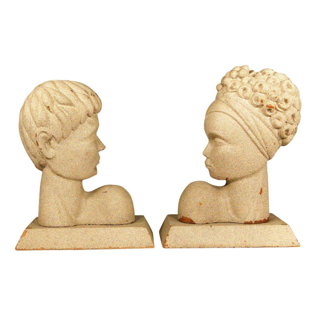 This pair of Hawaiian Mid-Century Modern bookends feature skillfully carved male and female busts that have been coated in a sand/plaster finish further enhancing their antiqued look. The figures were originally lamps and still retain holes if