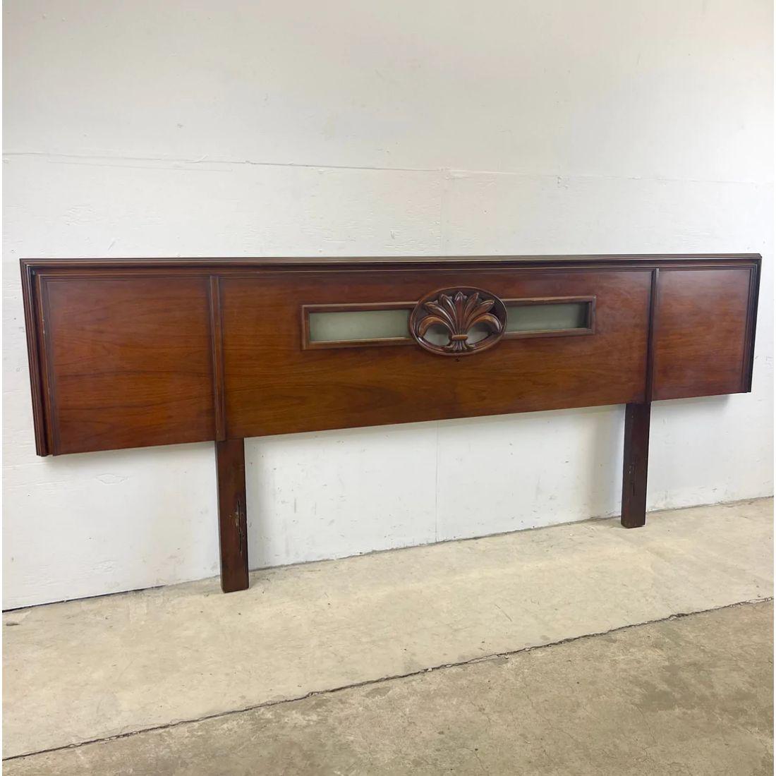 This over-sized mid-century modern headboard features a dark wood two tone finish with unique applied sculptural details and cutaway light boxes. The 96.25 inch wide side makes this an impressive focal point to any king size bedroom set, matching