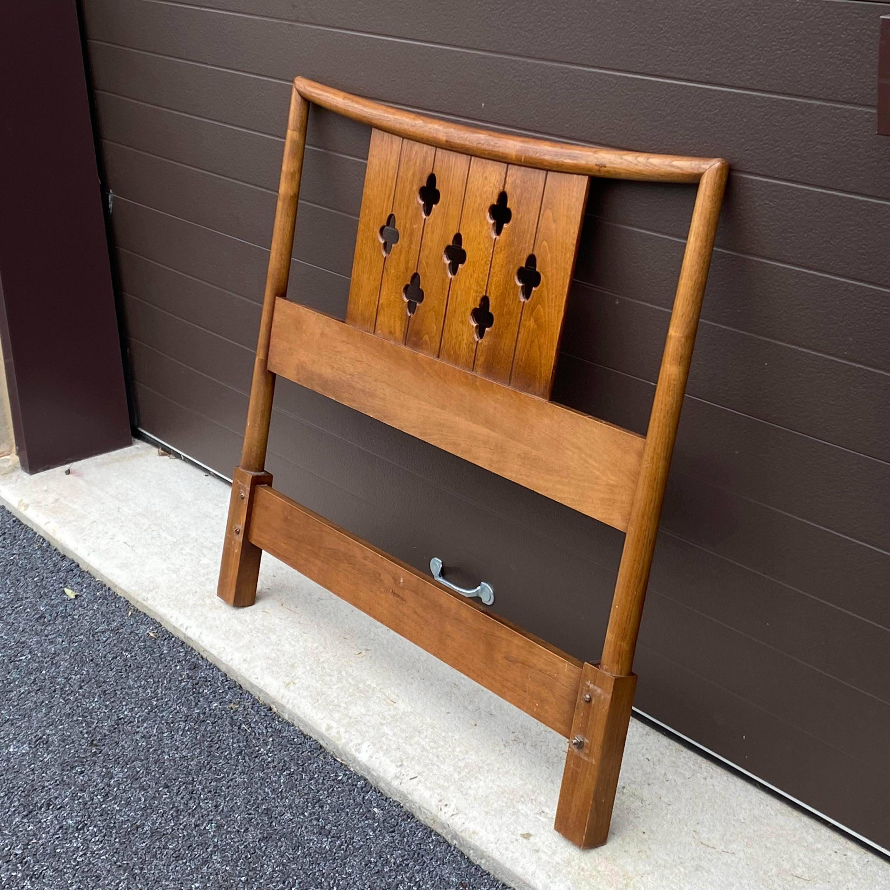 A beautiful sculpted walnut twin sized headboard from the Circa 60 series by Henredon Fine Furniture.
