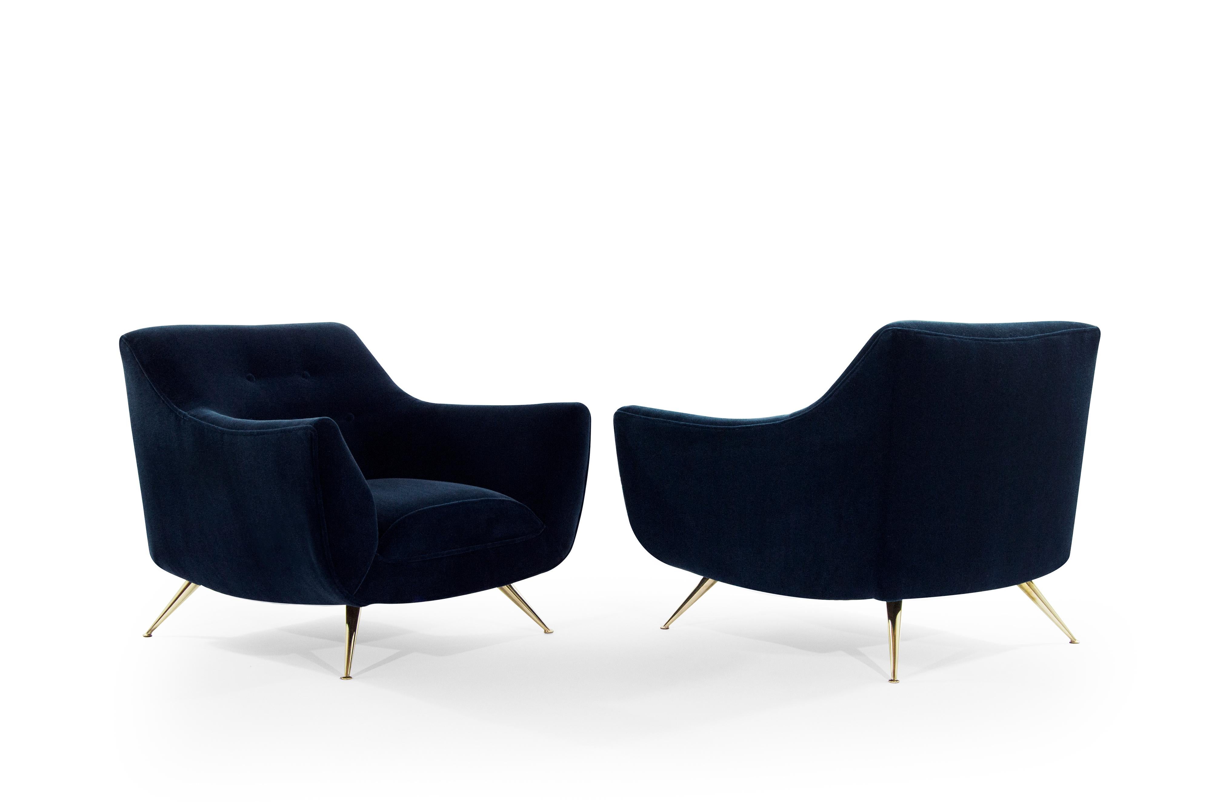 Pair of Henry Glass lounge chairs, newly upholstered in midnight blue mohair.

Chairs have been completely restored to their original integrity. They boast handcut high grade foam, as well as hand polished brass legs. Extremely rare pair perfect