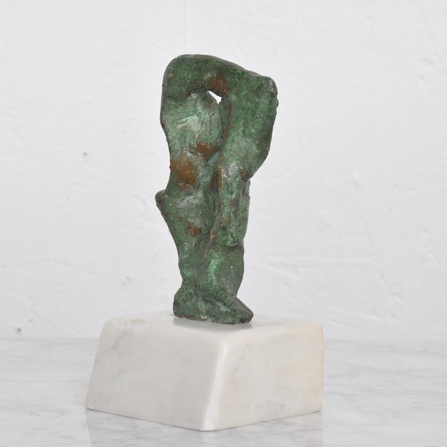 For your consideration a vintage Mid-Century Modern abstract bronze sculpture by Heriberto Juarez.

Verdi-gris patina in Carrara marble base. 

Signed in the back. No COA available. 

Measures: 6 1/2