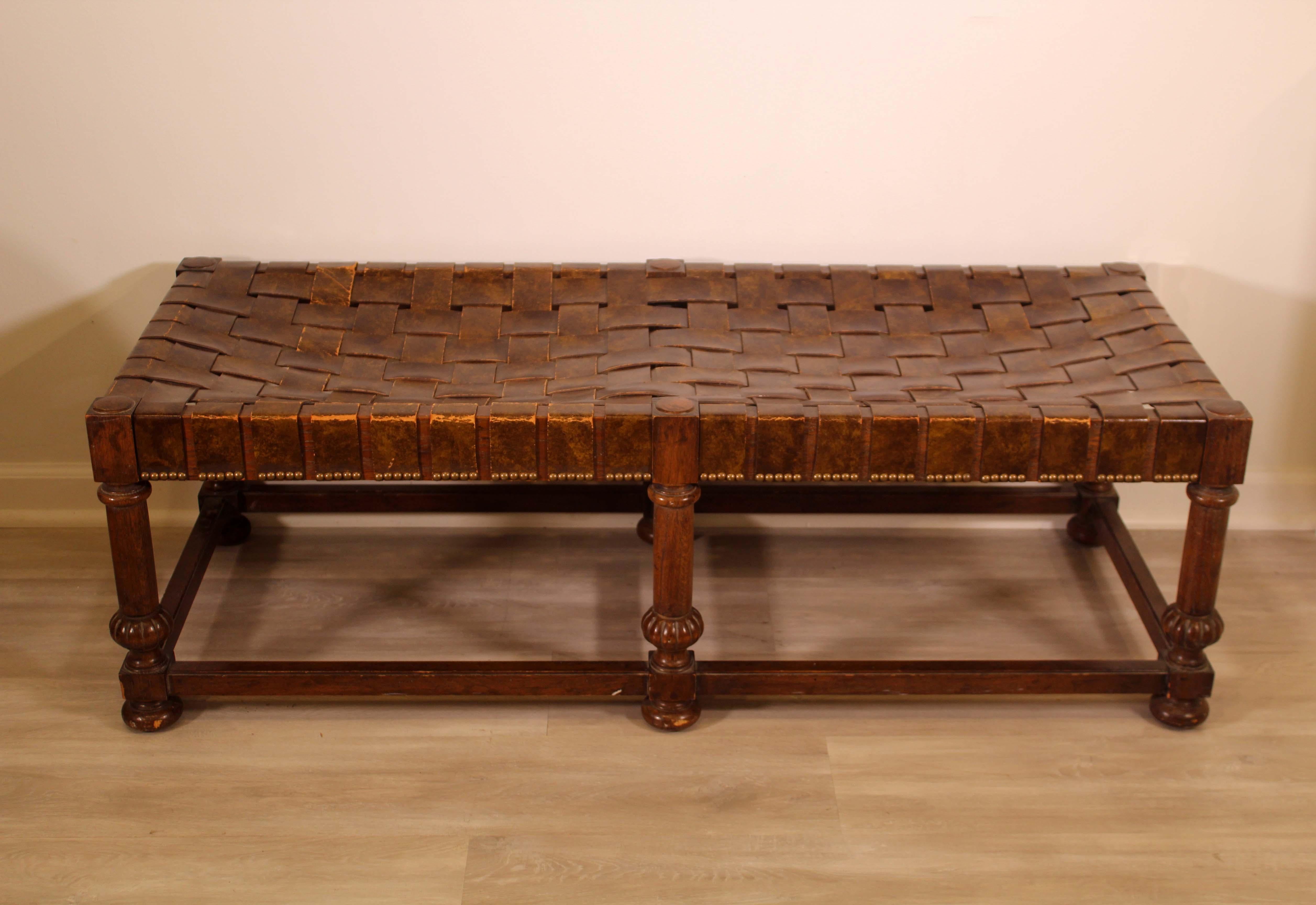 This lovely leather woven Heritage Grand Tour bench. In good condition. Dimensions: 50