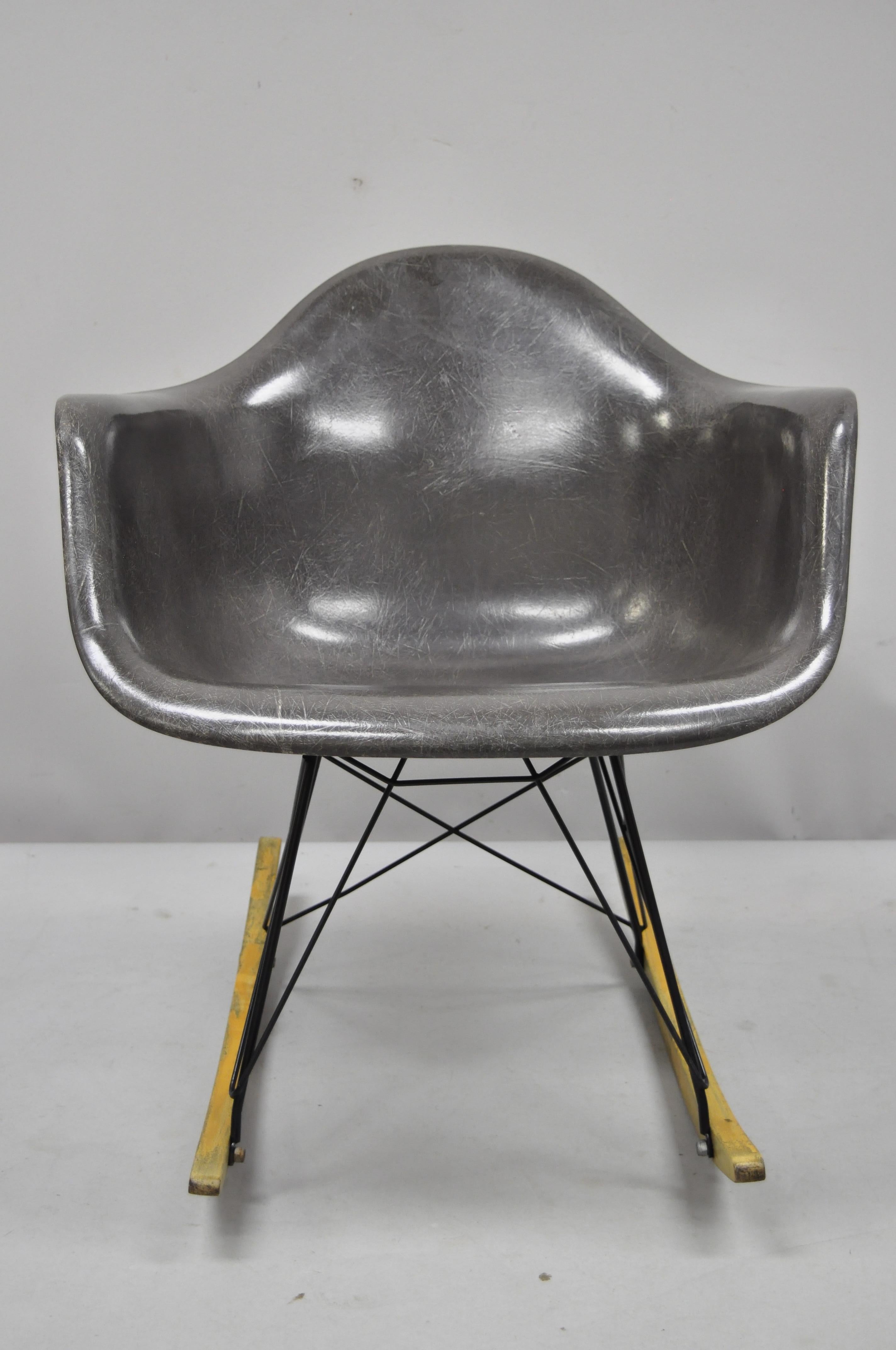 Vintage Mid-Century Modern Herman Miller Eames black fiberglass RAR rocking chair. Item features black fiberglass shell, original Herman Miller stamp to underside, very nice vintage item, circa mid-20th century. Measurements: 27