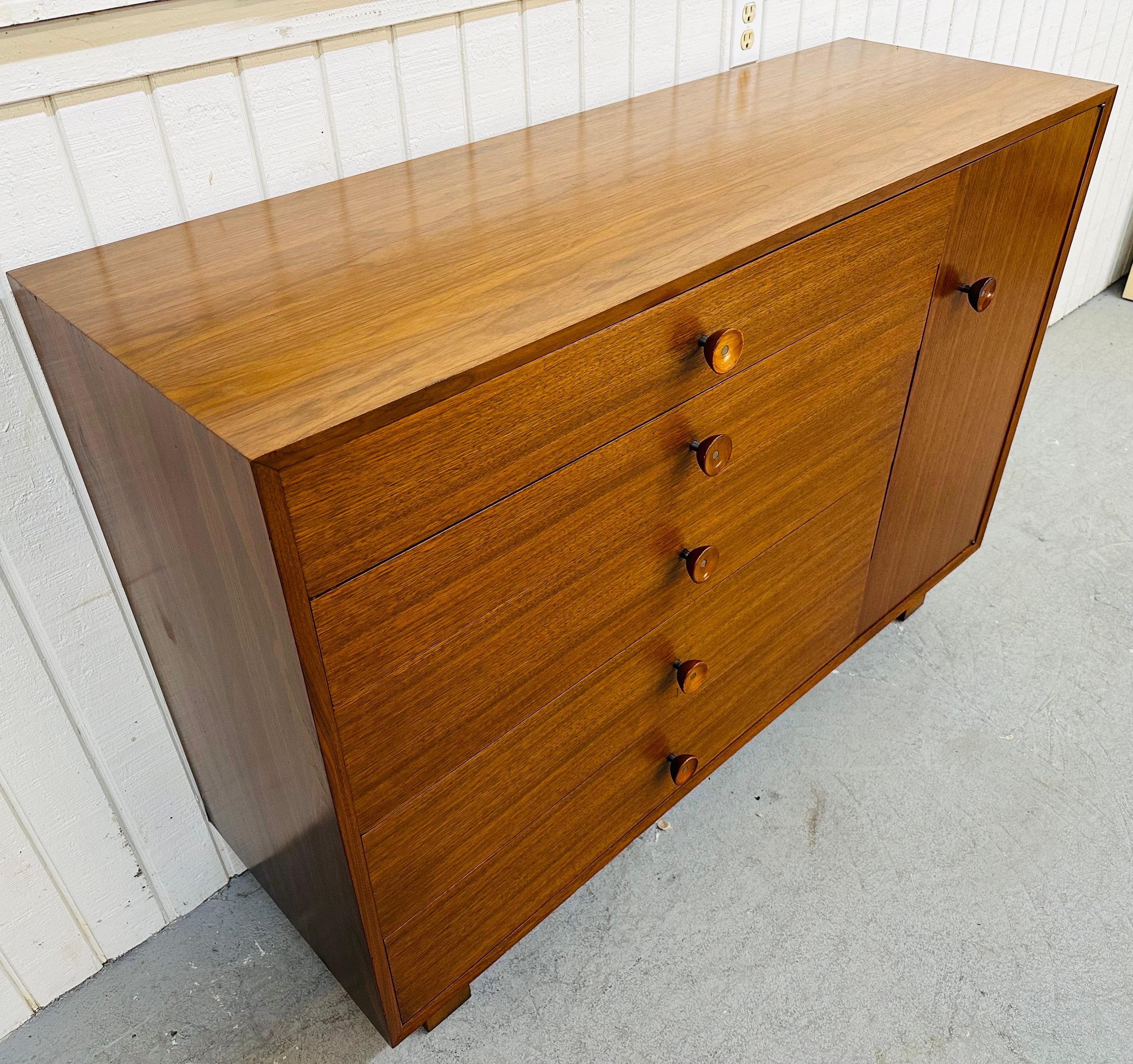 This listing is for a Mid-Century Modern Herman Miller Walnut Dresser for designer George Nelson. Featuring a rectangular straight line design, five drawers for storage, one door that opens up to storage space, a sliding tie rack, and original