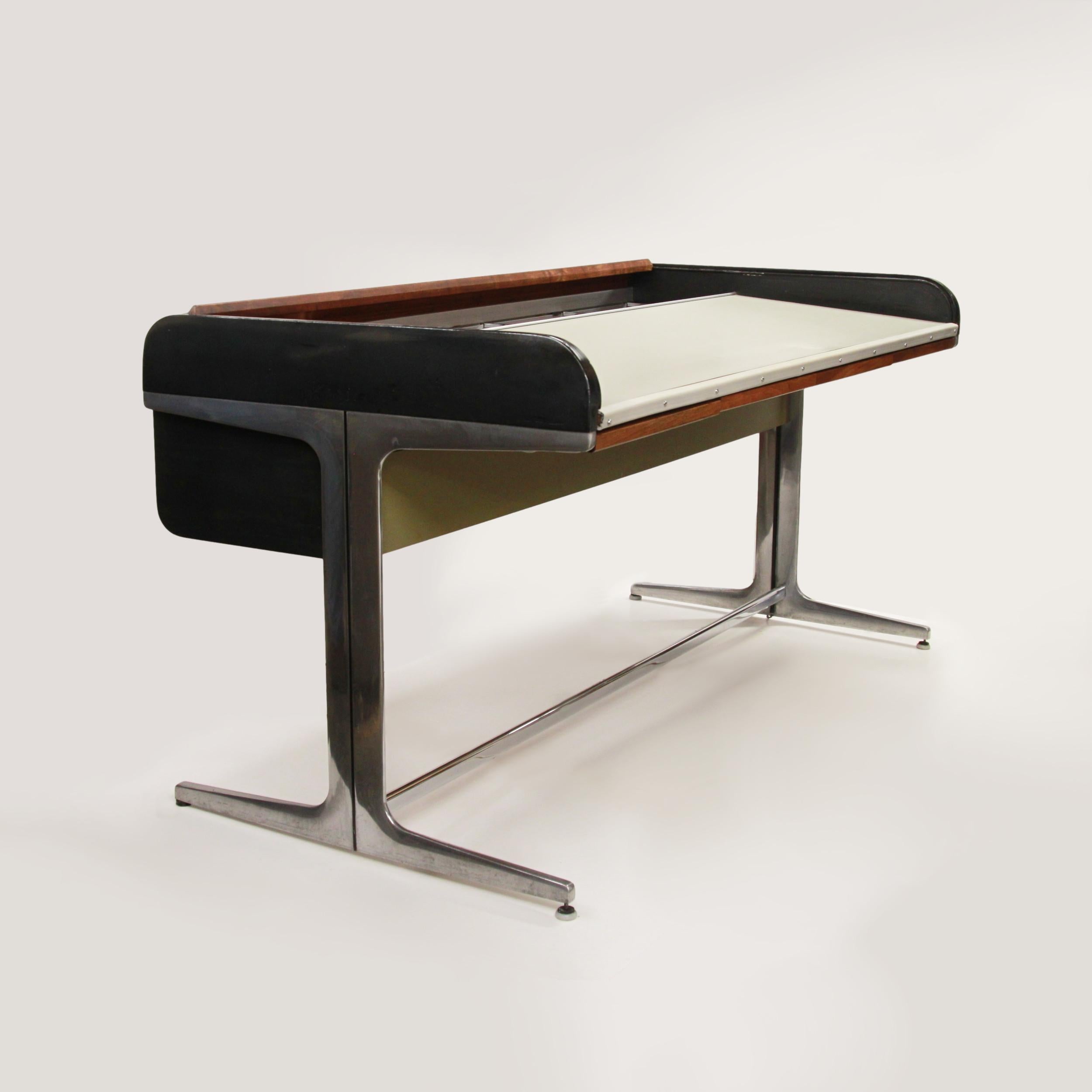 This is a wonderful early example of the Action Office Roll Top desk by George Nelson for Herman Miller.  

Desk features:
Walnut roll top
(4) action drawers
Ebonized black side panels
Deep inner file space
Cast aluminum frame
Foot rest
White