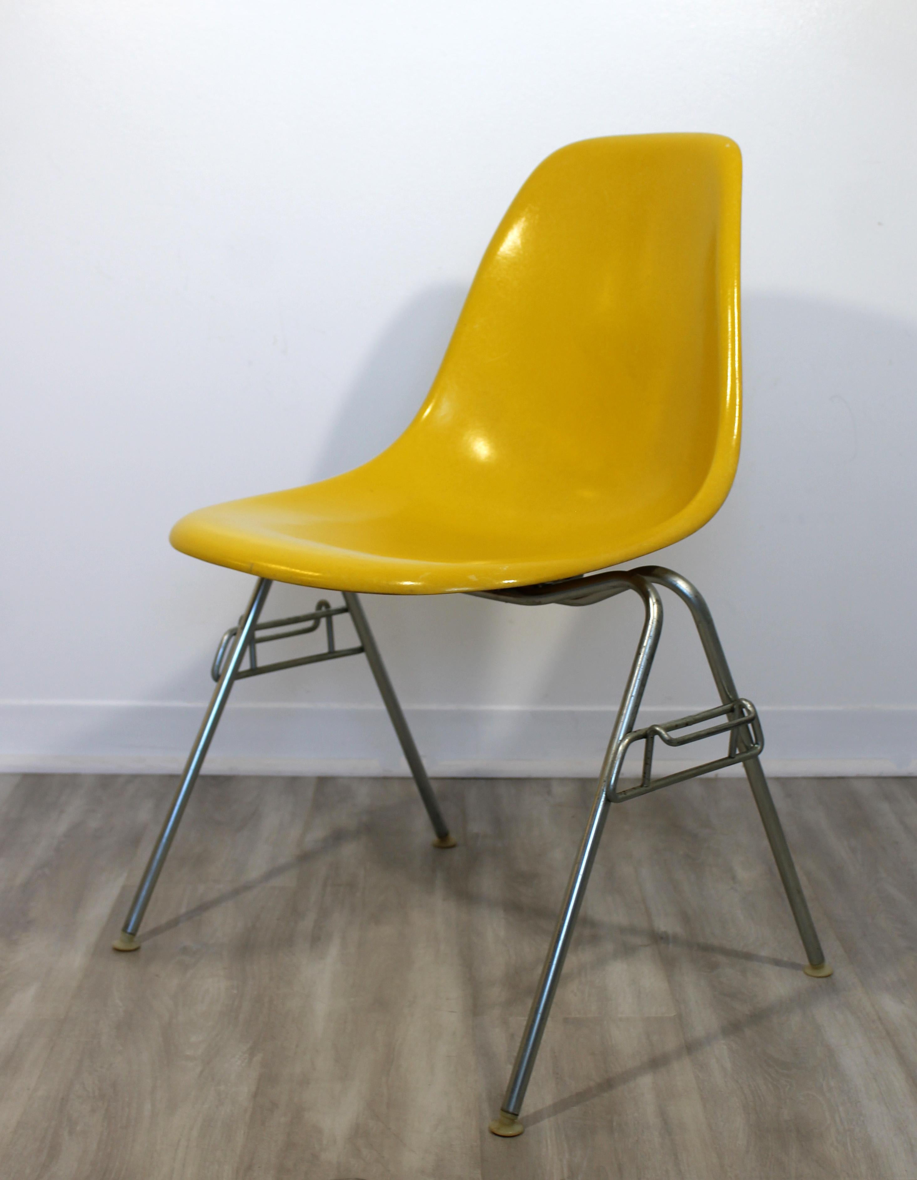 For your consideration is a fantastic set of four, yellow fiberglass shell, stacking side chairs, by Herman Miller, circa 1977. In excellent vintage condition. The dimensions of each chair are 22