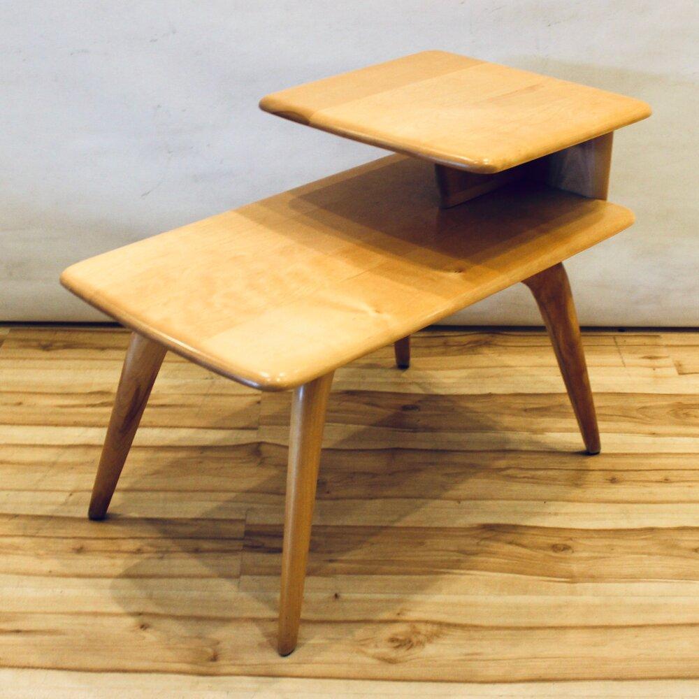Mid-Century Modern Heywood-Wakefield birch maple step end table. In excellent condition, the table has been professionally refinished and restored. Marked on the underside.

Measures: Width: 17 in / Depth: 29 in / Height: 22 in.