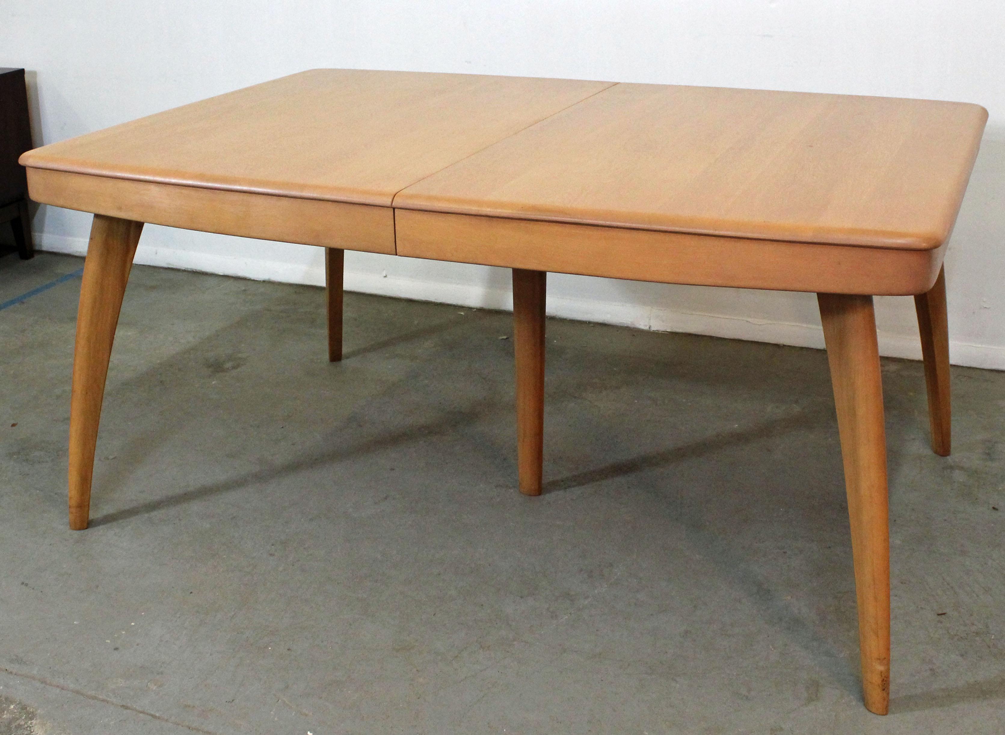 Offered is a Mid-Century Modern dining table by Heywood-Wakefield. It is made from solid birch and includes two 15