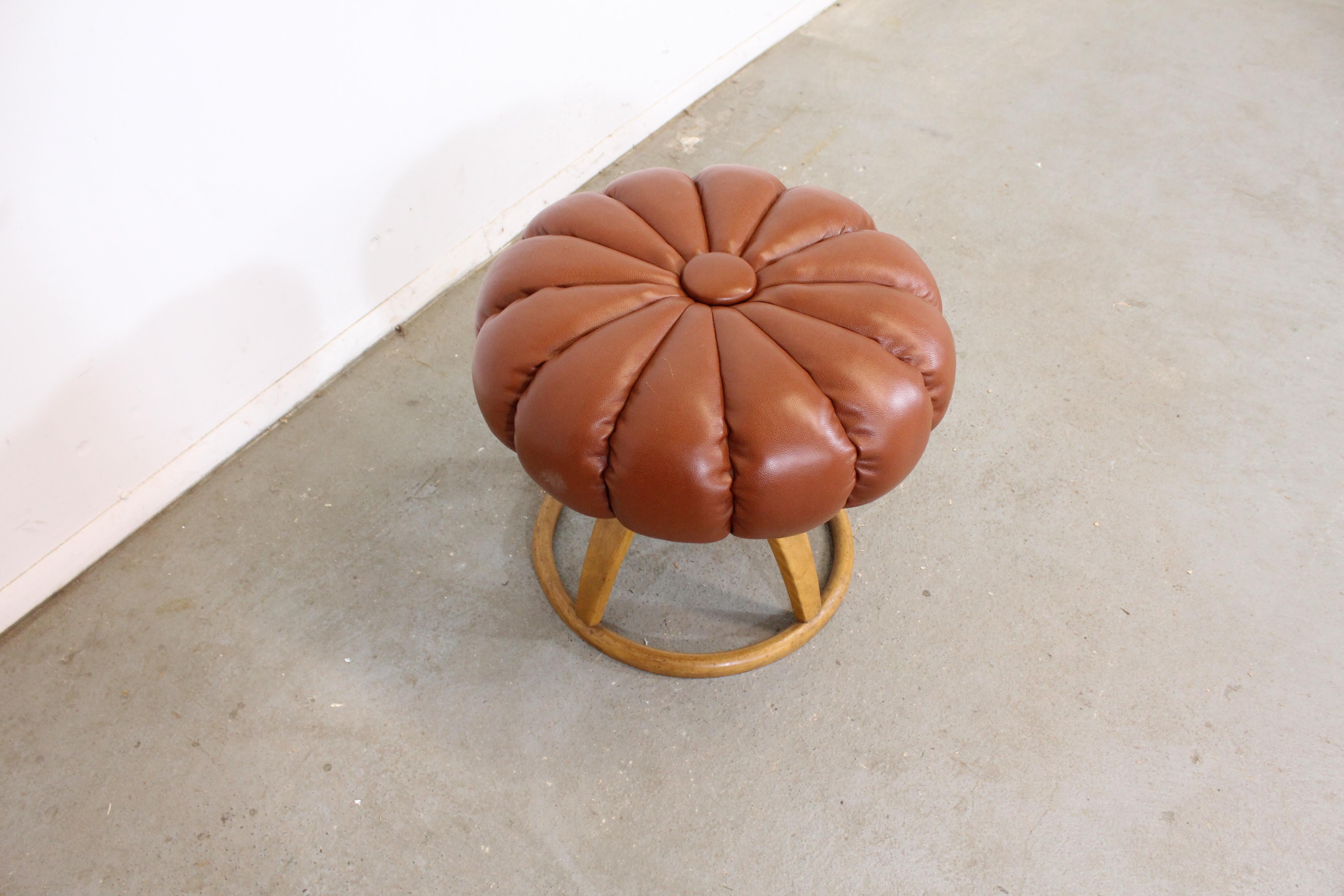 Mid-Century Modern Heywood Wakefield ottoman

Offered is a Mid-Century Modern Heywood Wakefield Champagne ottoman/pouf. It is structurally sound, and has been refinished. It does have a crack in the base and a few scratches on the top. It is in