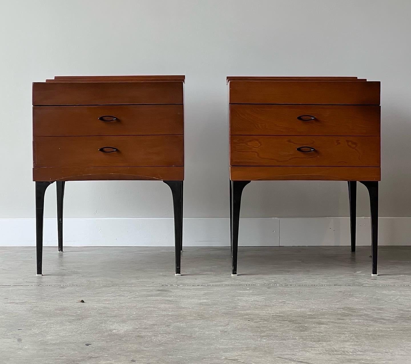 Outstanding seldomly seen pair of rare mid century modern Heywood Wakefield Contessa line nightstands. Top tray slides back and forth covering and allowing open or covered top. The steel black tapered thin legs are just phenomenal. Oval shaped metal