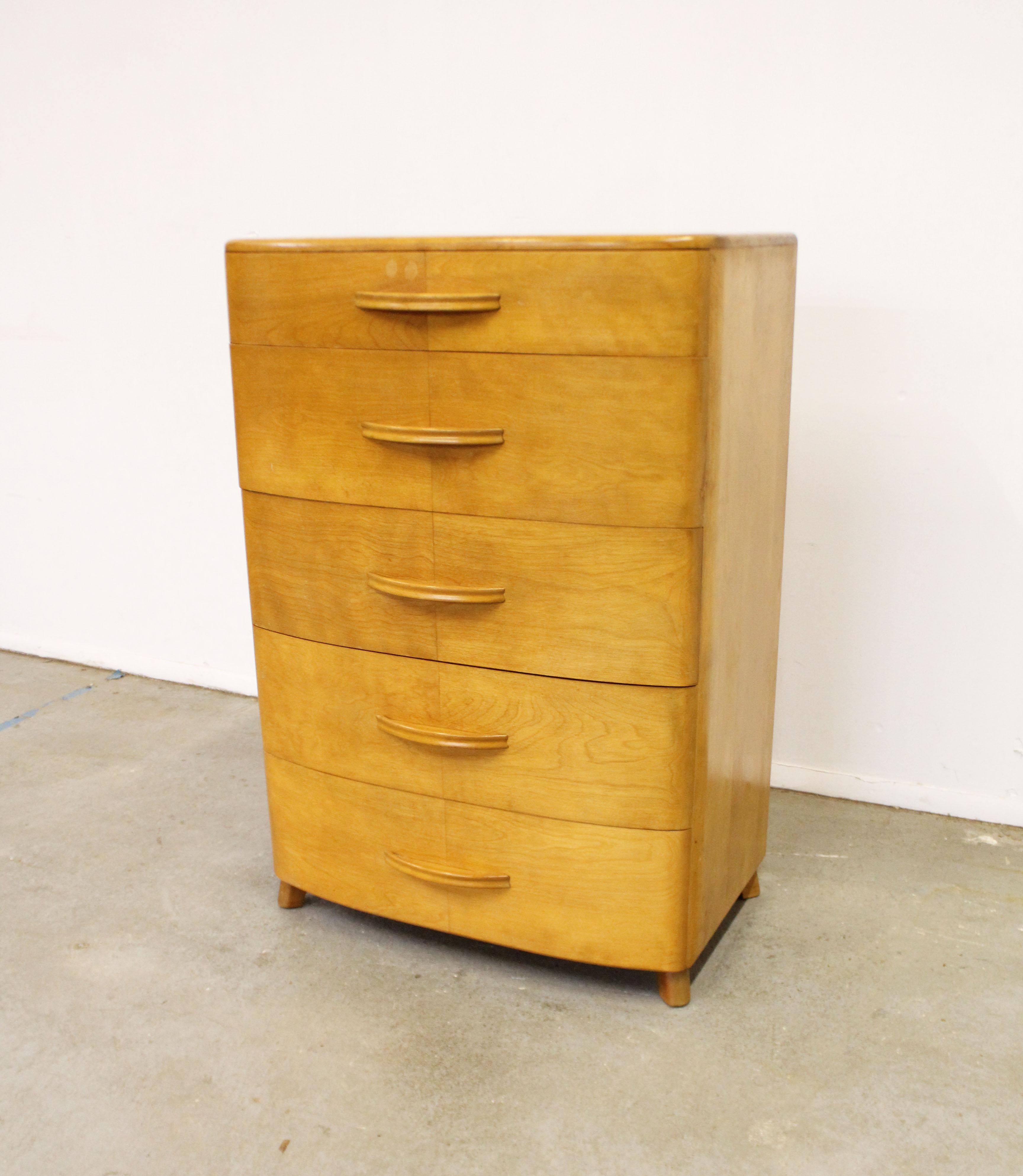 What a find. Offered is a vintage tall chest/dresser designed by Alexis de Sakhnoffsky for Heywood Wakefield's 'Crescendo' line. It is made of birch and features a Streamlined Modern look. The piece is in decent condition considering its age (circa