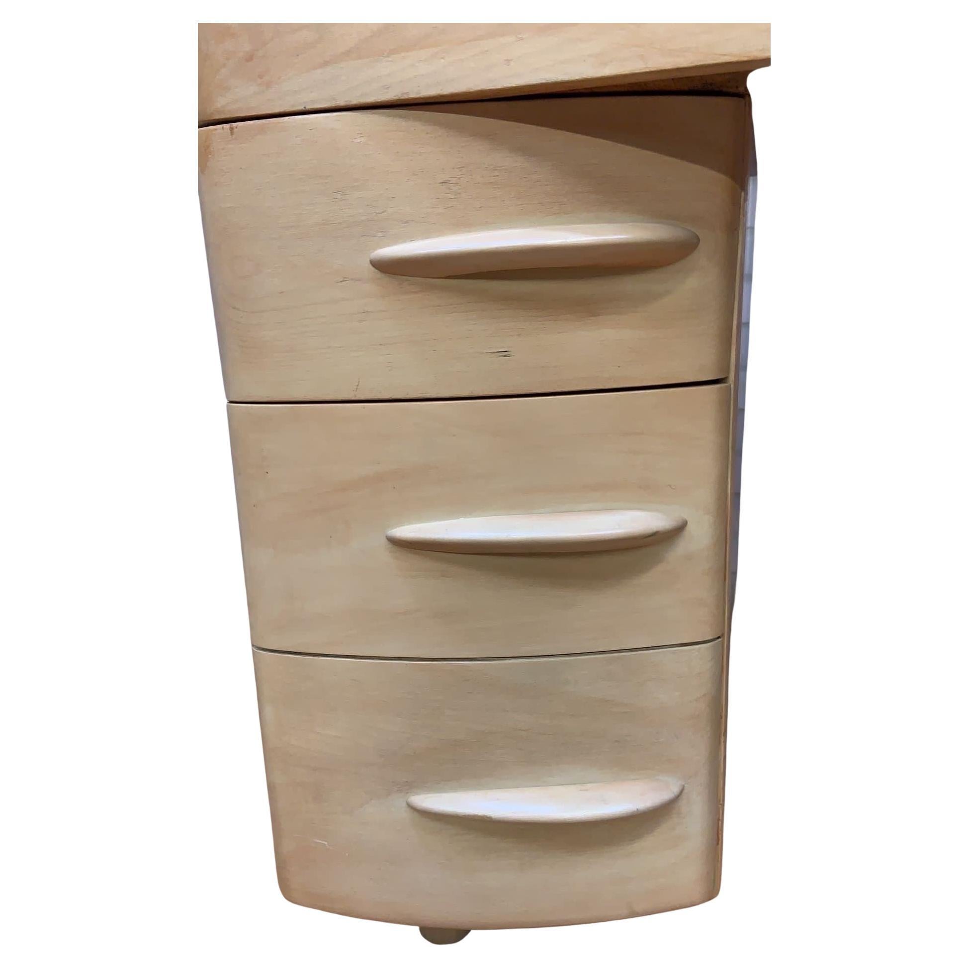 Mid-Century Modern Heywood Wakefield Desk 

Beautiful MCM compact Heywood Wakefield desk. Solid construction with a large curved top drawer and 4 generous storage drawers supported by wedge shaped feet. 

circa: 1950

Dimensions:

W 46”
D