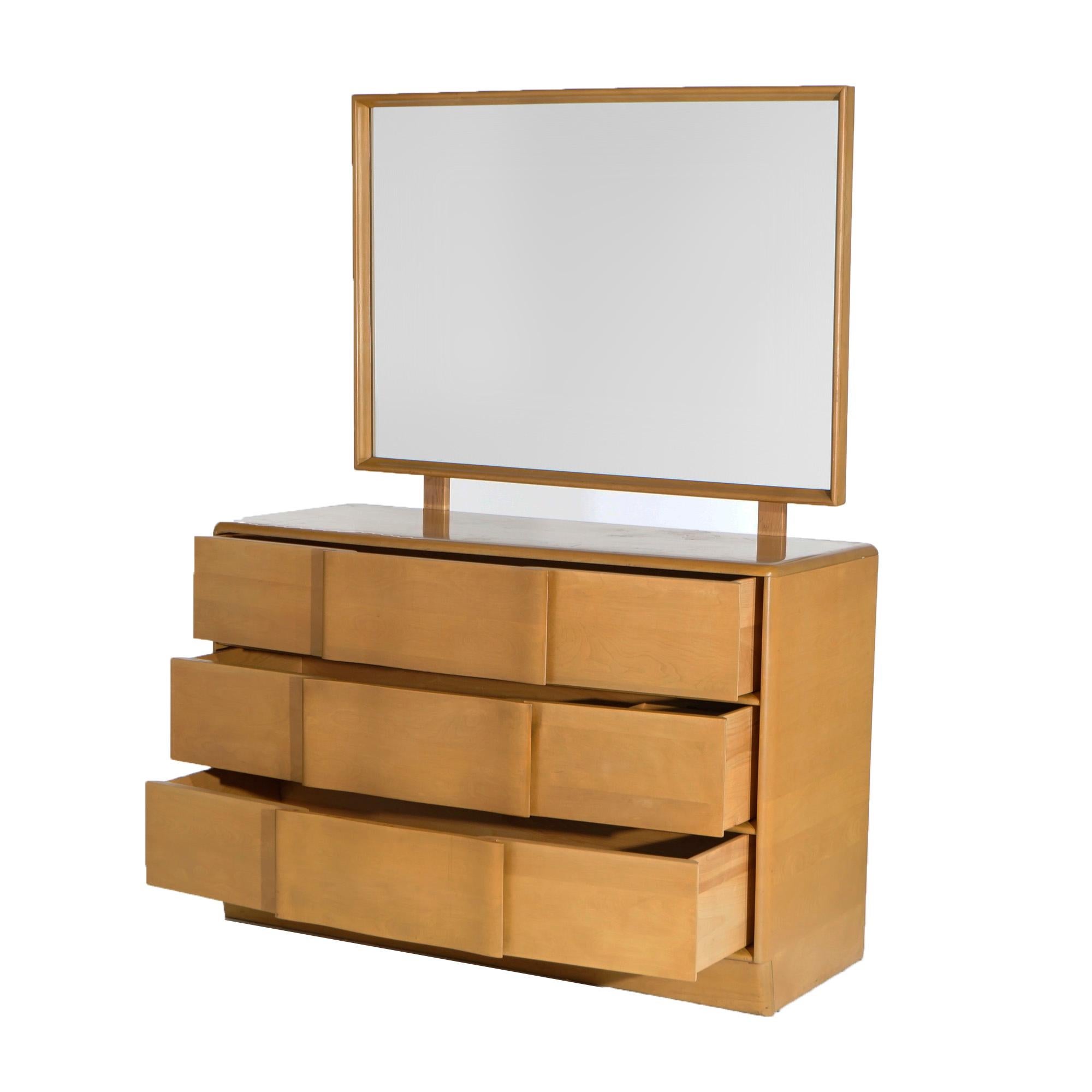Mid Century Modern Heywood Wakefield Dresser & Mirror offers Birch Construction in Wheat Finish with Three Long Drawers, Circa 1950

Measures- 62.75''H x 45.75''W x 19.25''D