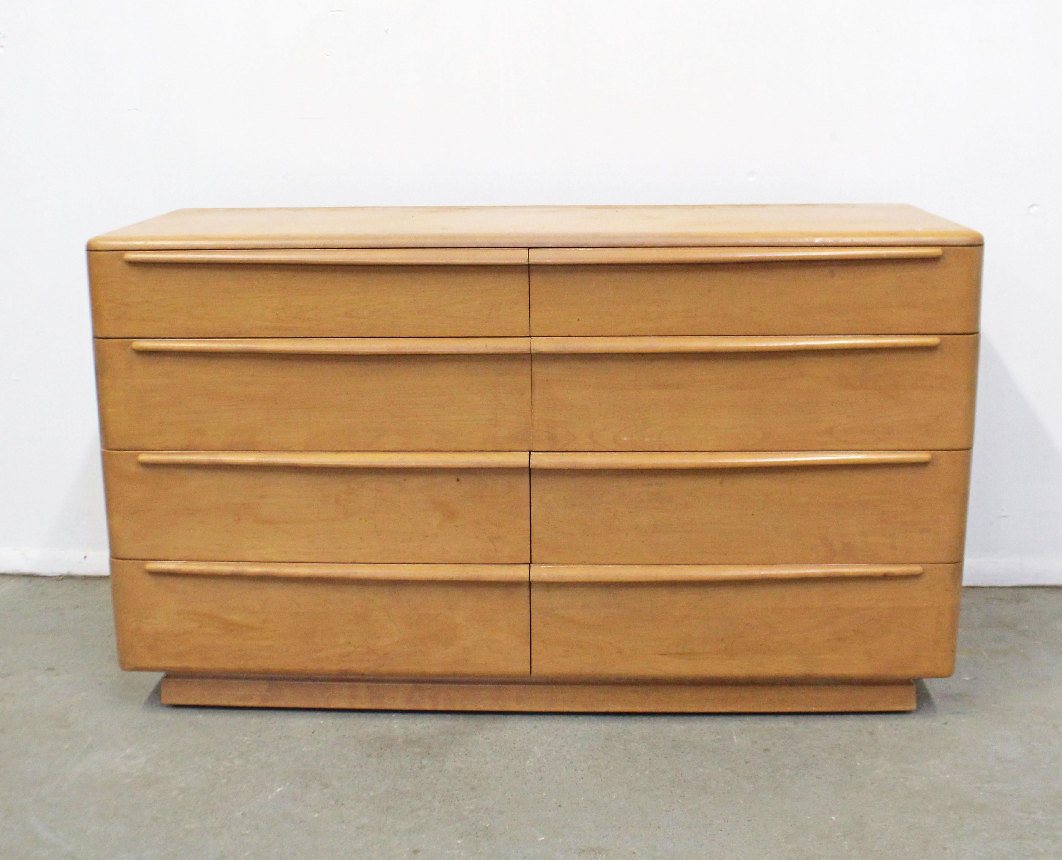 What a find. Offered is a vintage Mid-Century Modern dresser by Heywood Wakefield 'Encore,' circa 1957. This piece is built to last, made from yellow birch with eight drawers. Can be used as a sideboard or dresser. In decent condition considering