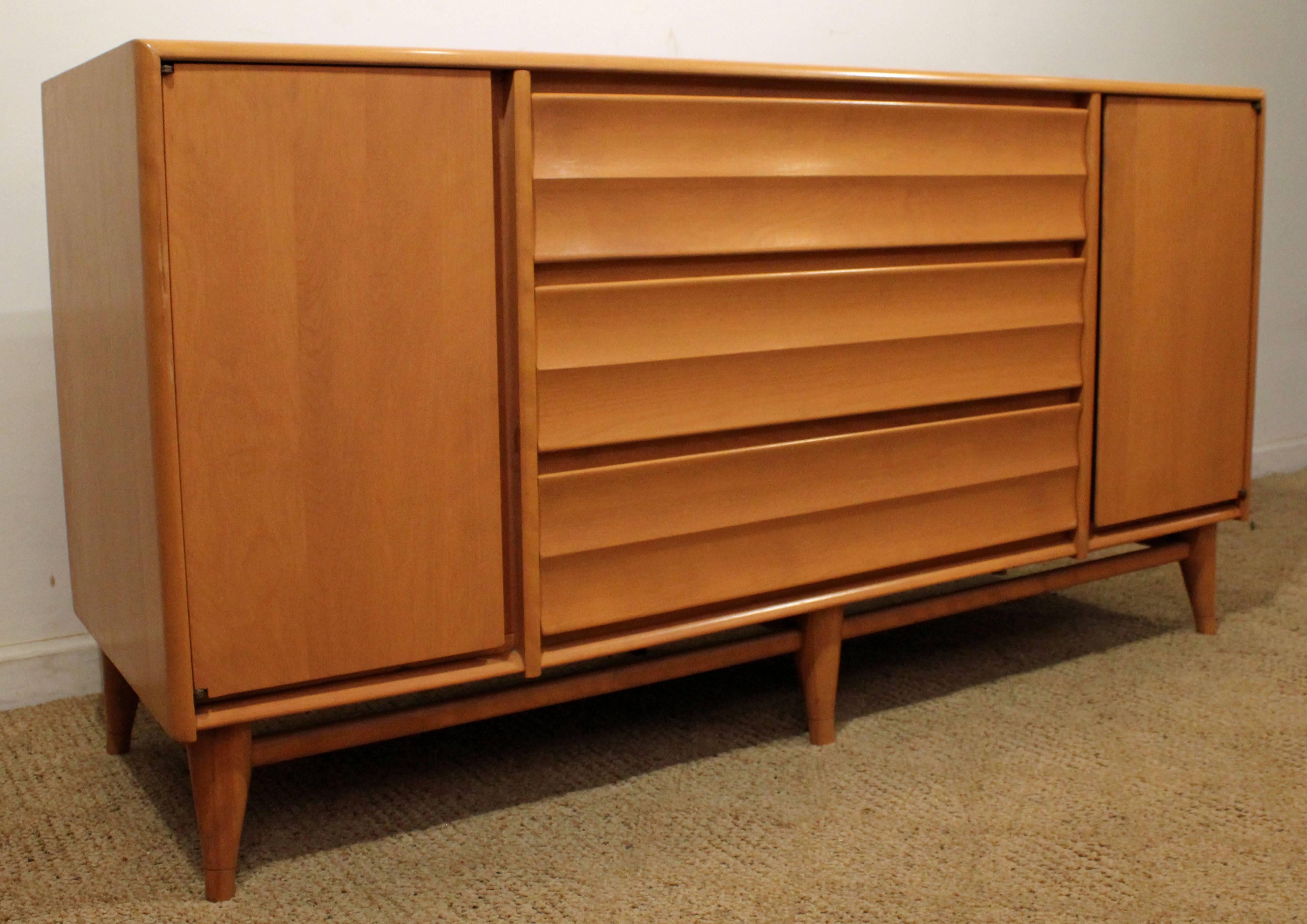 Offered is a Heywood Wakefield credenza from their 
