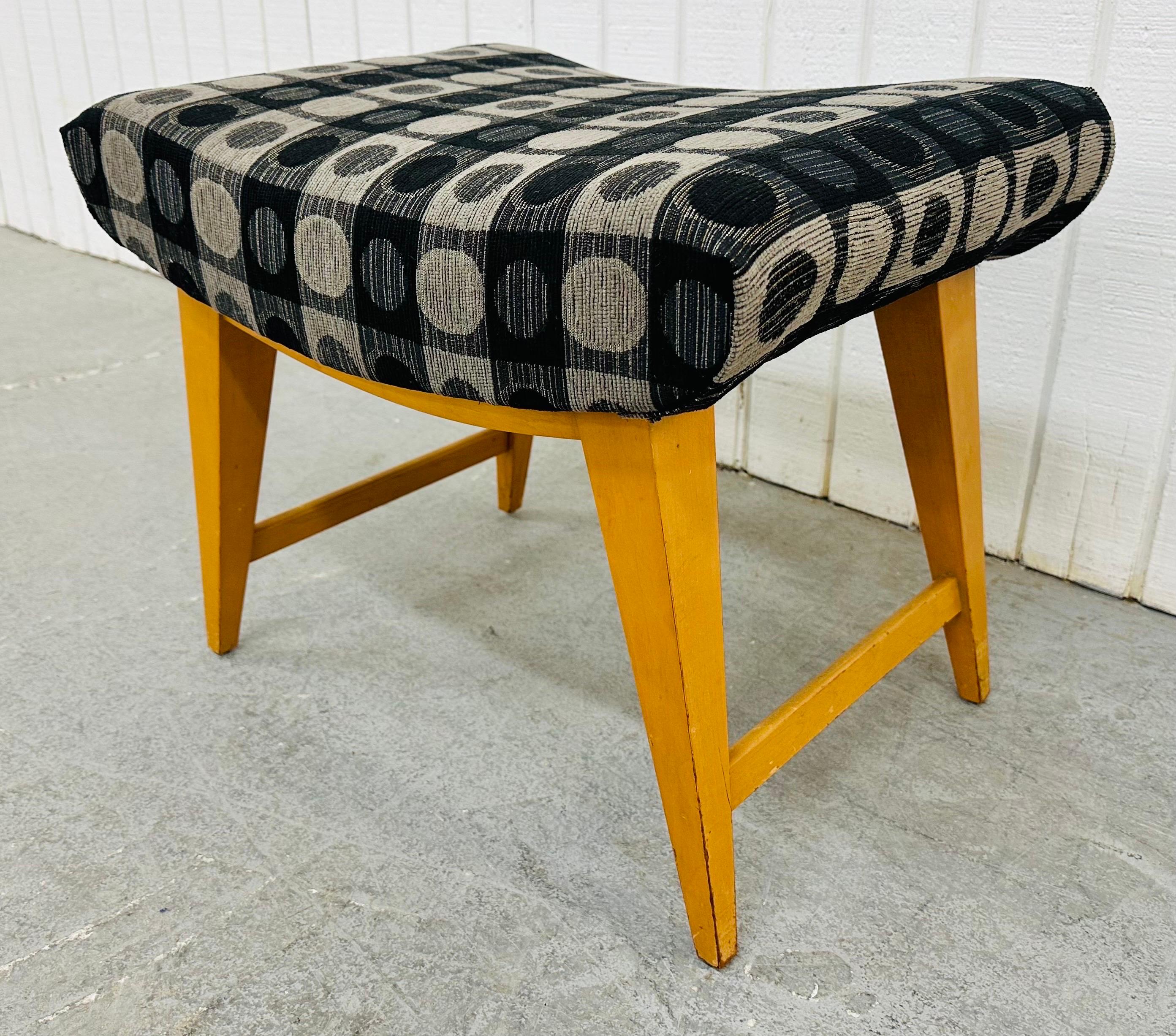 This listing is for a Mid-Century Modern Heywood Wakefield Ottoman. Featuring a curved rectangular top, champagne wood legs, and new upholstery! This is an exceptional combination of quality and design by Heywood Wakefield!