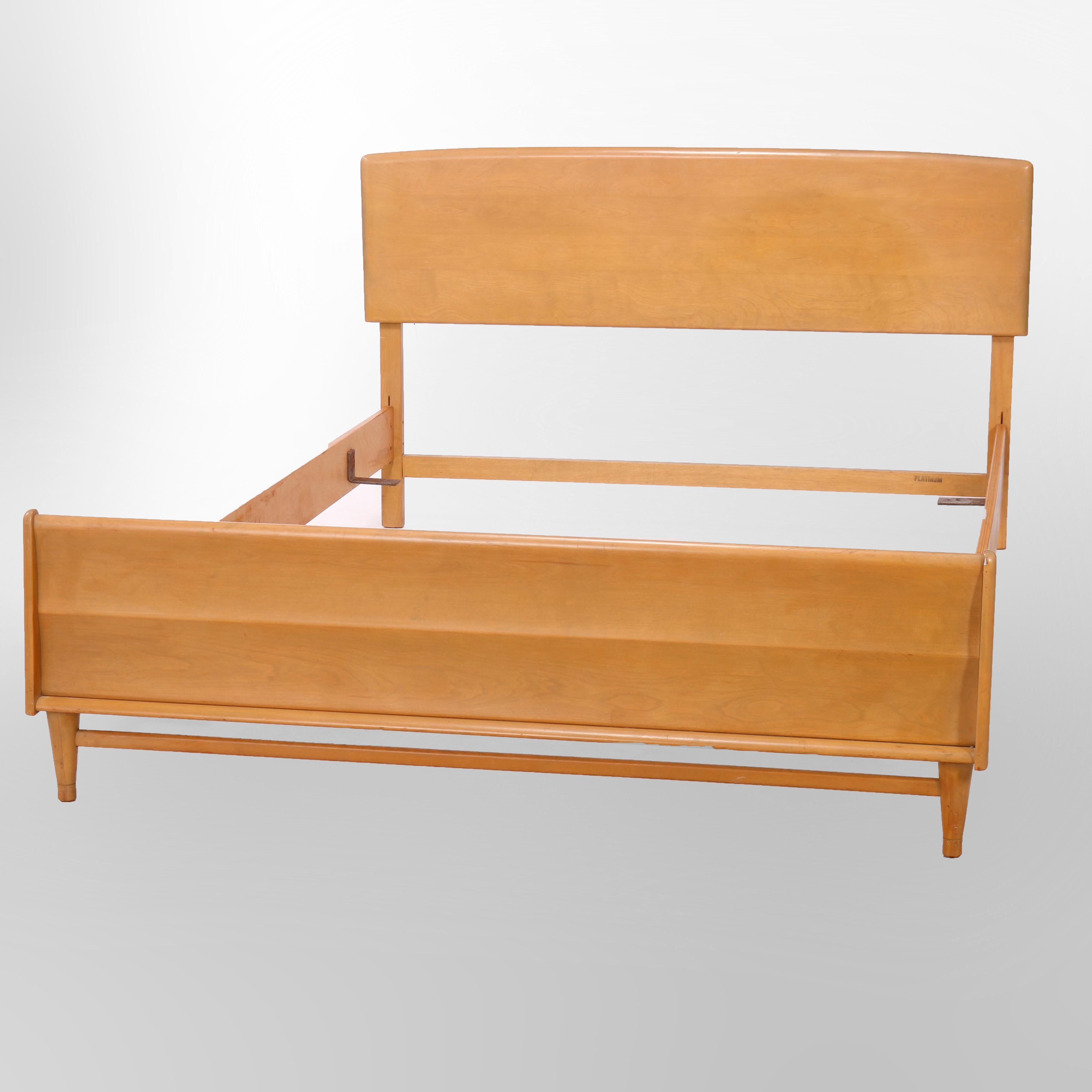 A Mid Century Modern full or double bed frame by Heywood Wakefield offers birch construction in Platinum finish, maker stamp as photographed, mid 20th century

Measures - overall 35''h x 59''w x 80.75''d; interior 7.5