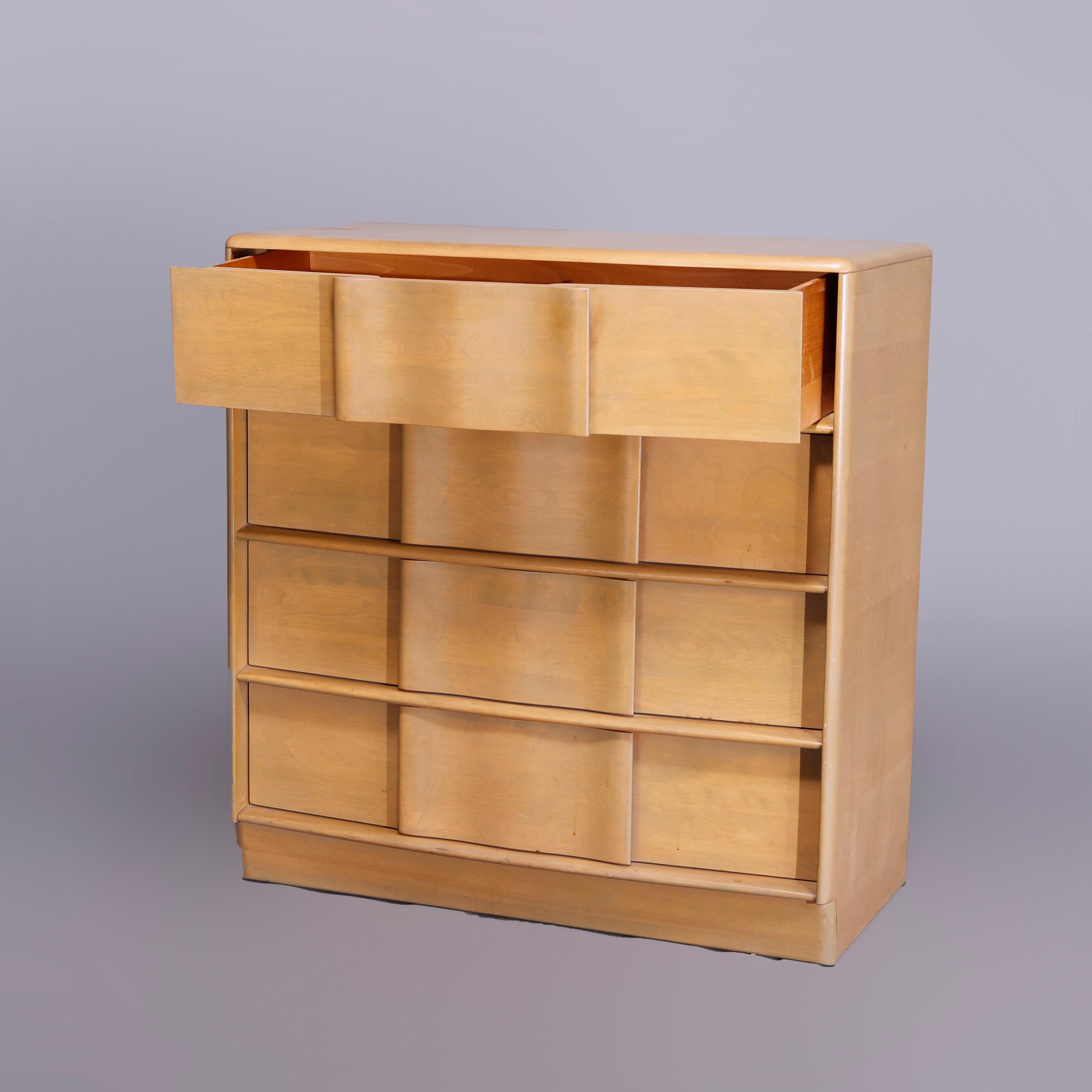 A Mid-Century Modern Heywood Wakefield high boy dresser in the Sculptura pattern offers birch construction with case having four long drawers, platinum finish, en verso maker mark as photographed, c1950

Measures- 40'' H x 38'' W x 19.25'' D.