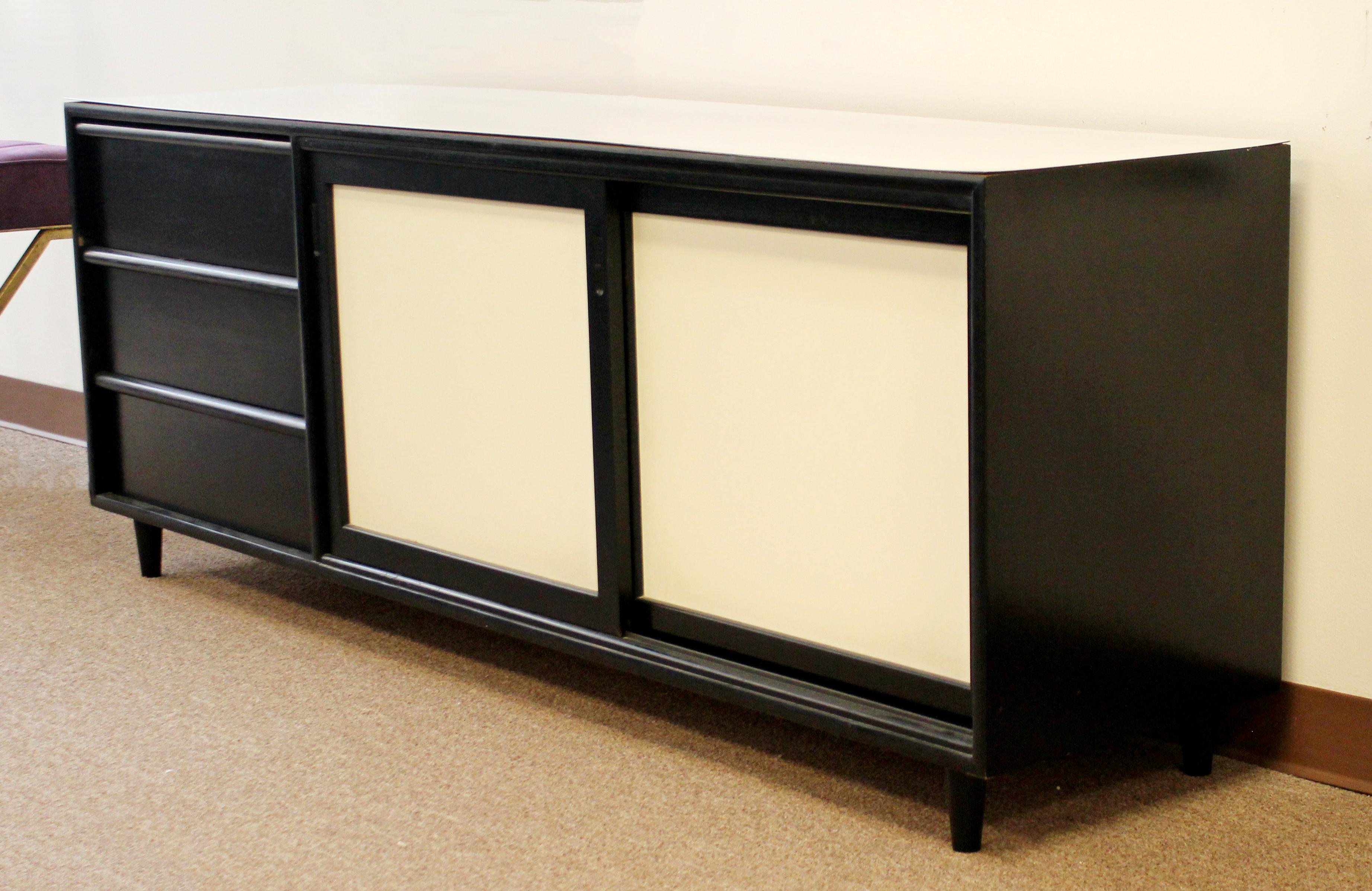For your consideration is a marvelous, black and white credenza, with three drawers, by Hibriten, circa 1960s. In excellent vintage condition. The dimensions are 71.25