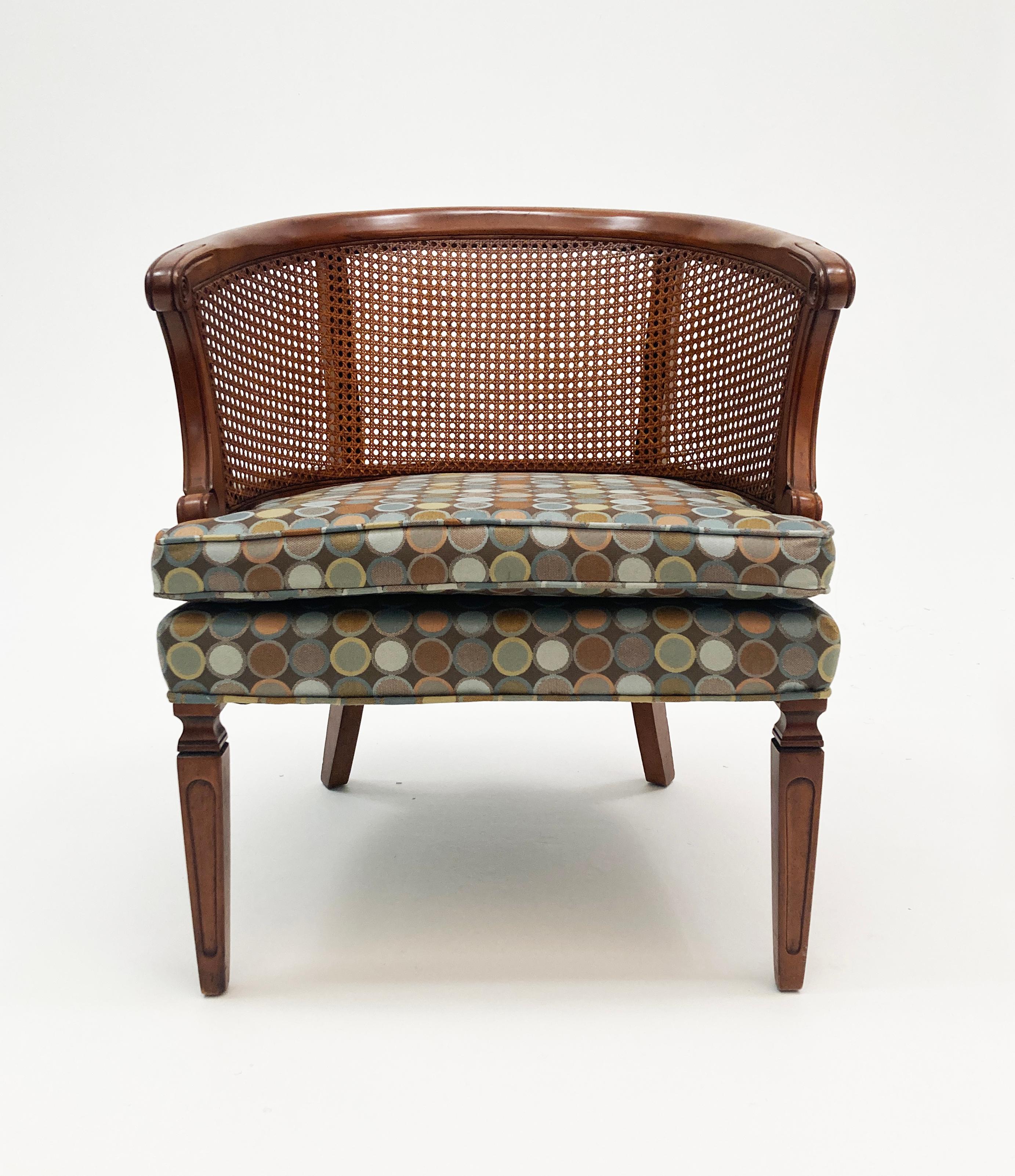 Another chapter of mid-century modern opens with this beautiful barrel back cane chair from Hickory Chair Company. Newly reupholstered in contemporary MCM dot patterned fabric in a beautiful color palette, this chair is not only comfortable, but