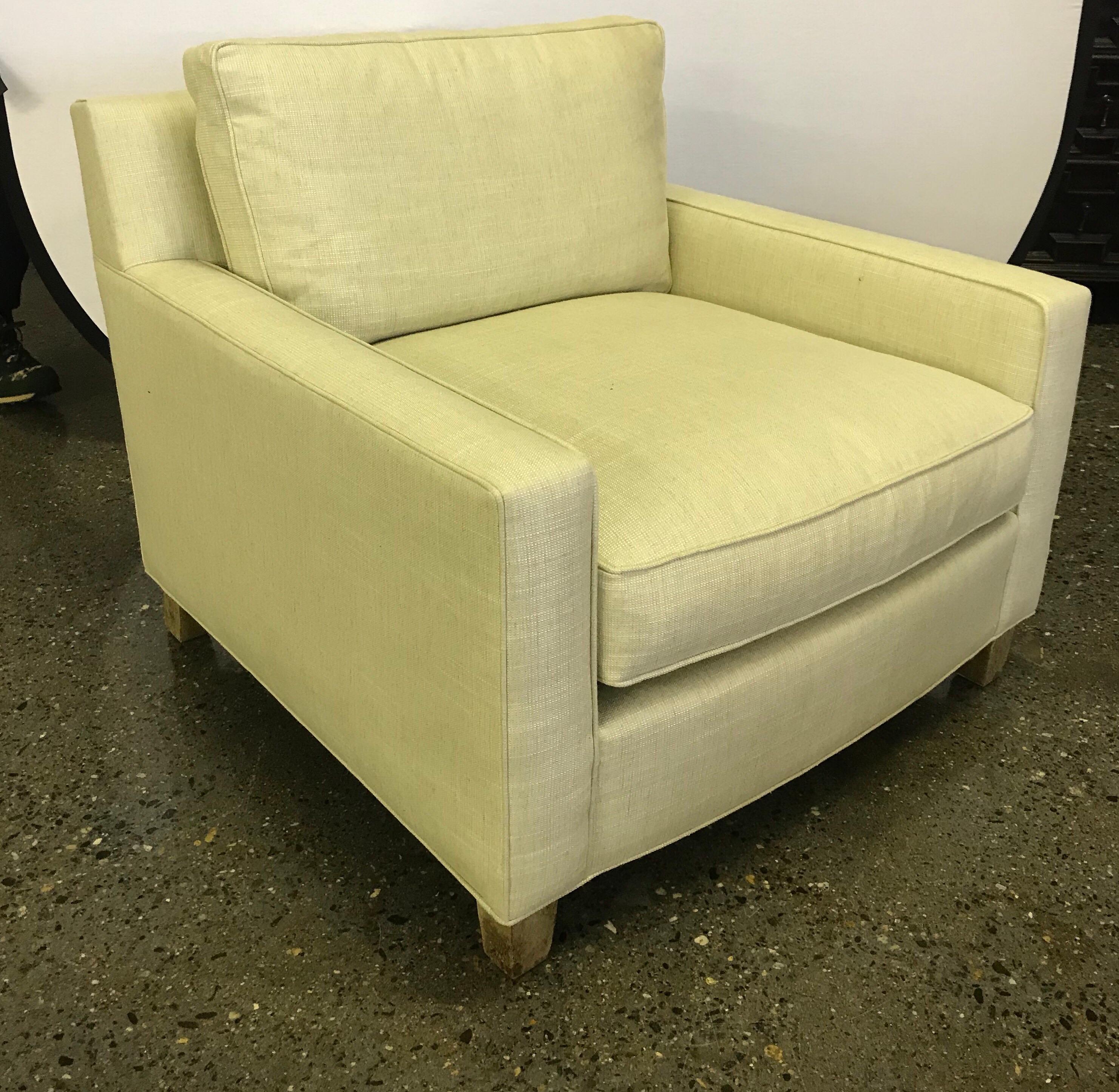 Midcentury style lounge chair has a deep comfortable seat and a wonderful modern aesthetic. Upholstery is pale yellow. Comes with two matching pillows. By Hickory Chair Furniture Company.