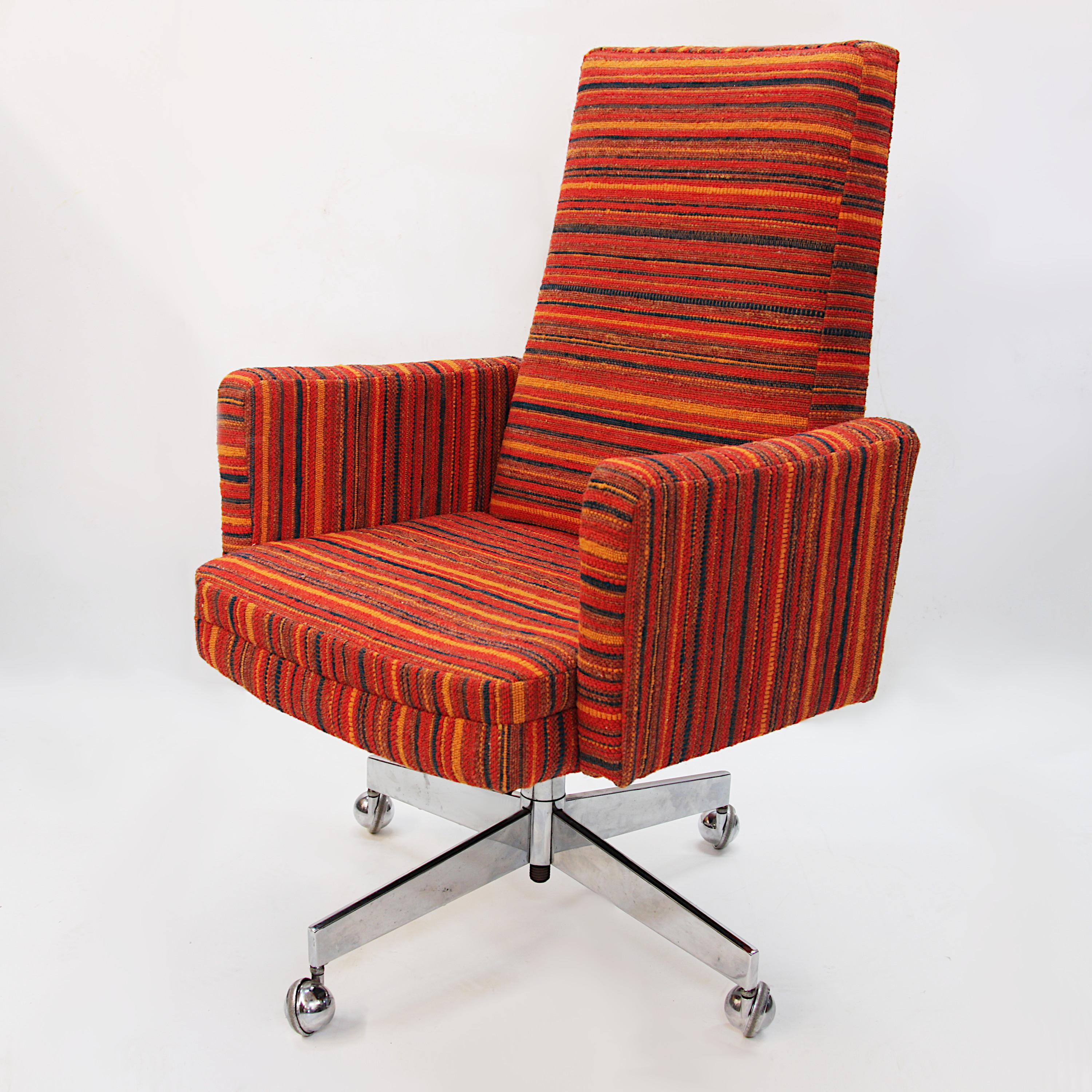 This awesome Gunlocke desk chair has been given a full restoration. Chrome base has been thoroughly cleaned and polished (some minor blemishes/tarnish remains). Original brown cloth upholstery has been professionally replaced with colorful, 