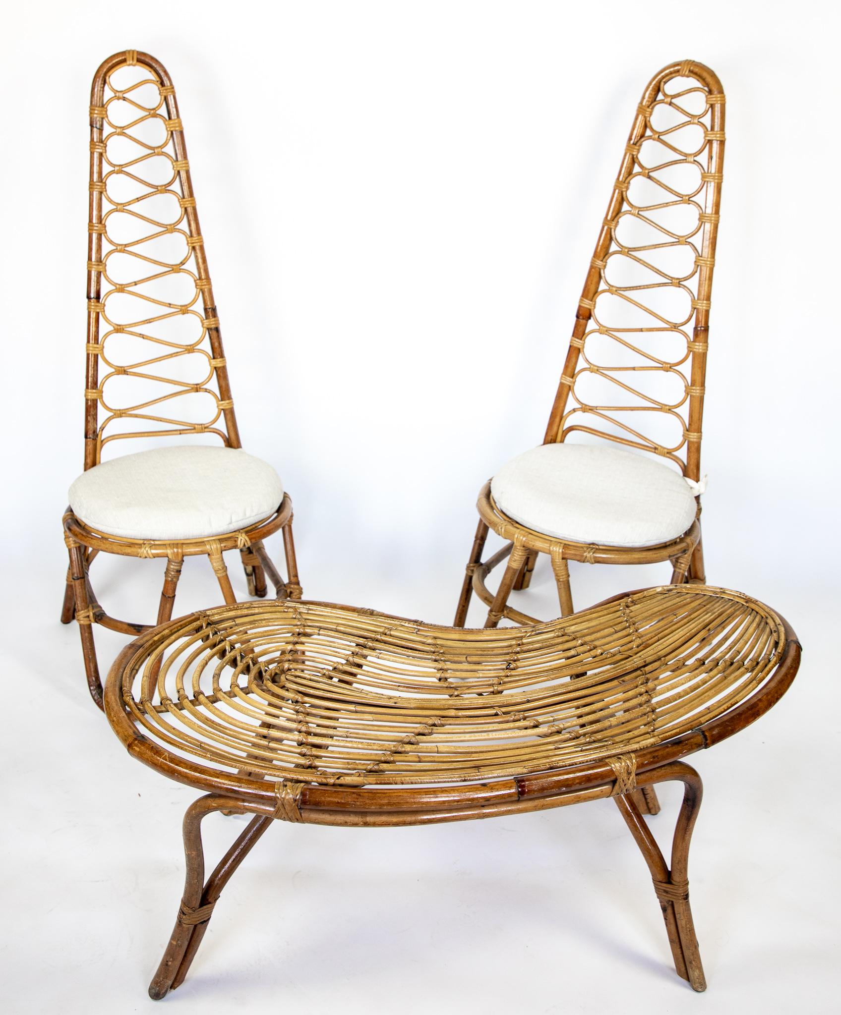 Mid-Century Modern high back rattan chairs and table, Italy 1960s.

This lovely set of two original Italian mid-century high back rattan chairs and a small table was often found in the entrance halls of the typical splendid villas in Italy in the