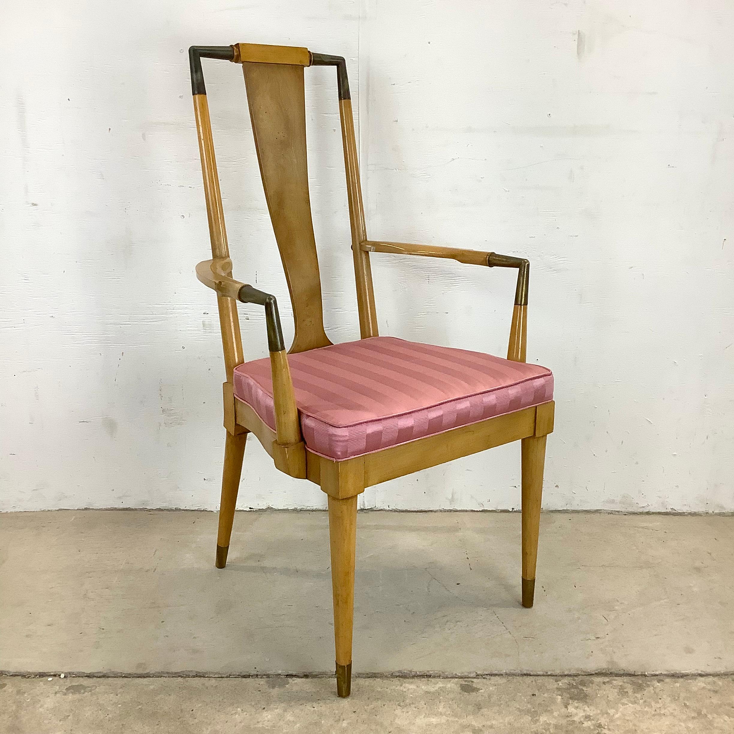 This striking set of six vintage modern dining chairs make a unique statement in any dining room setting, mixing burlwood finish and brass details, complimented by upholstered pink seats. The matching set of high back dining chairs includes five