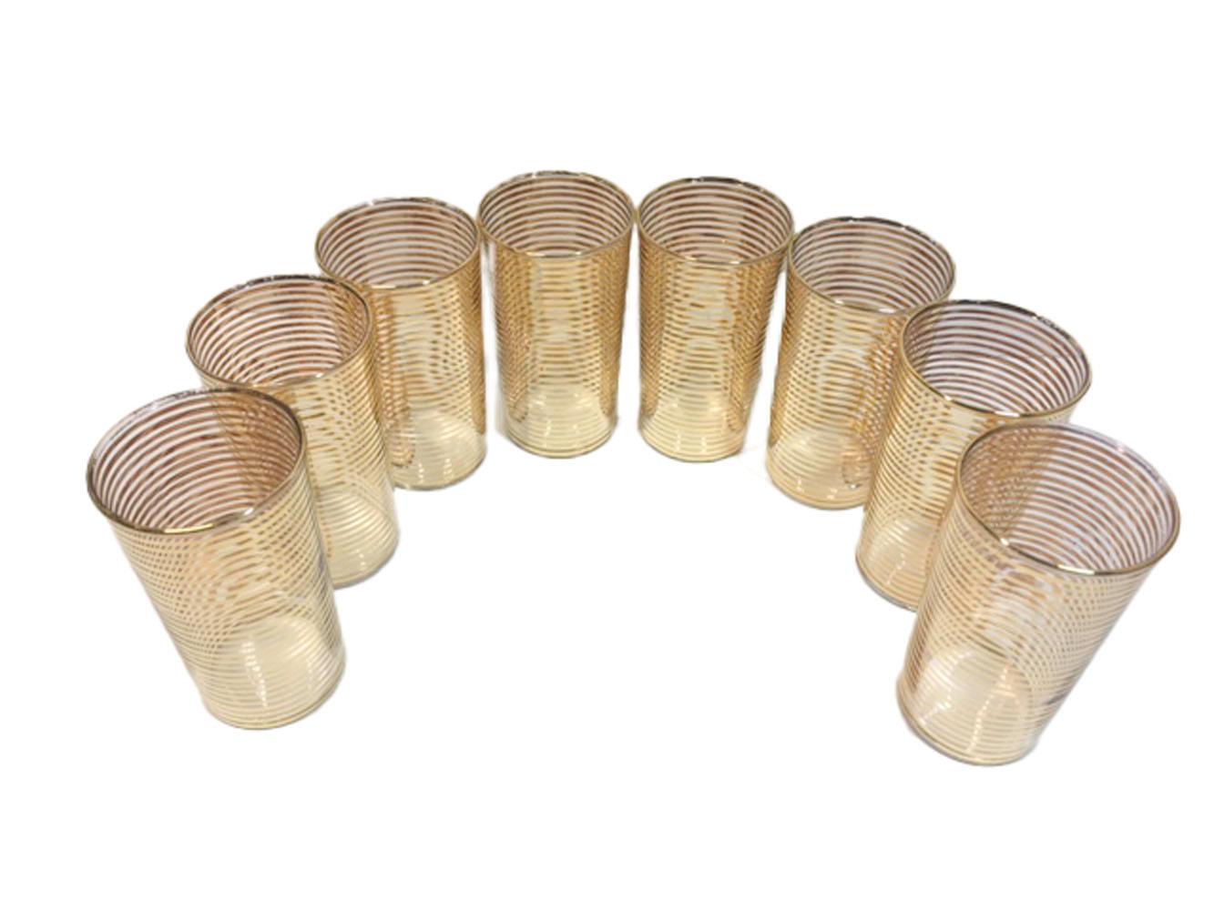 Set of 8 Art Deco highball glasses with alternating gold and clear bands.