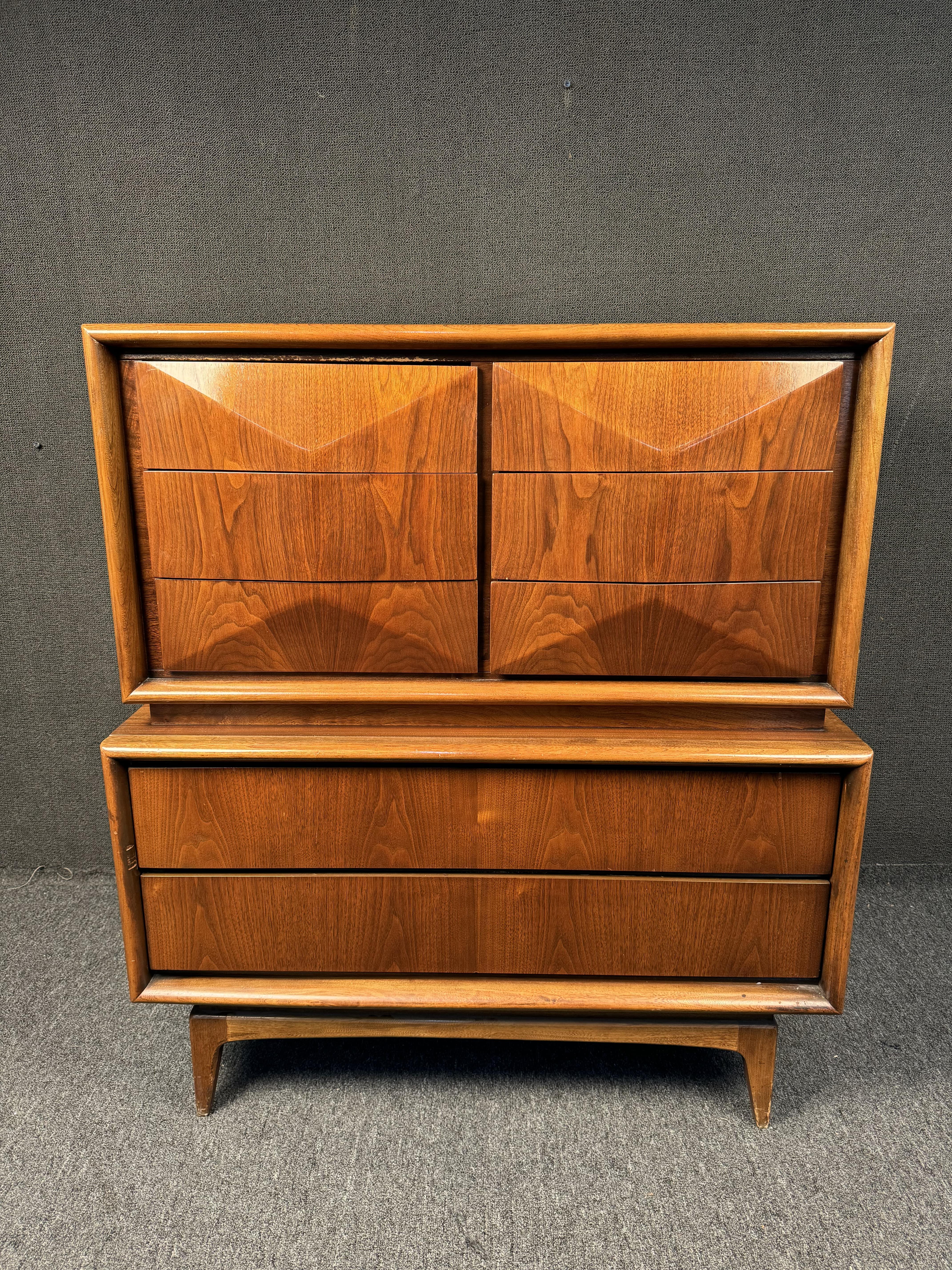 Gorgeous diamond front Highboy Dresser by United Furniture Company from the 1960s. This distinctive dresser complements the Danish-inspired design profile of the collection and embodies the craftsmanship of that era. Please confirm location with