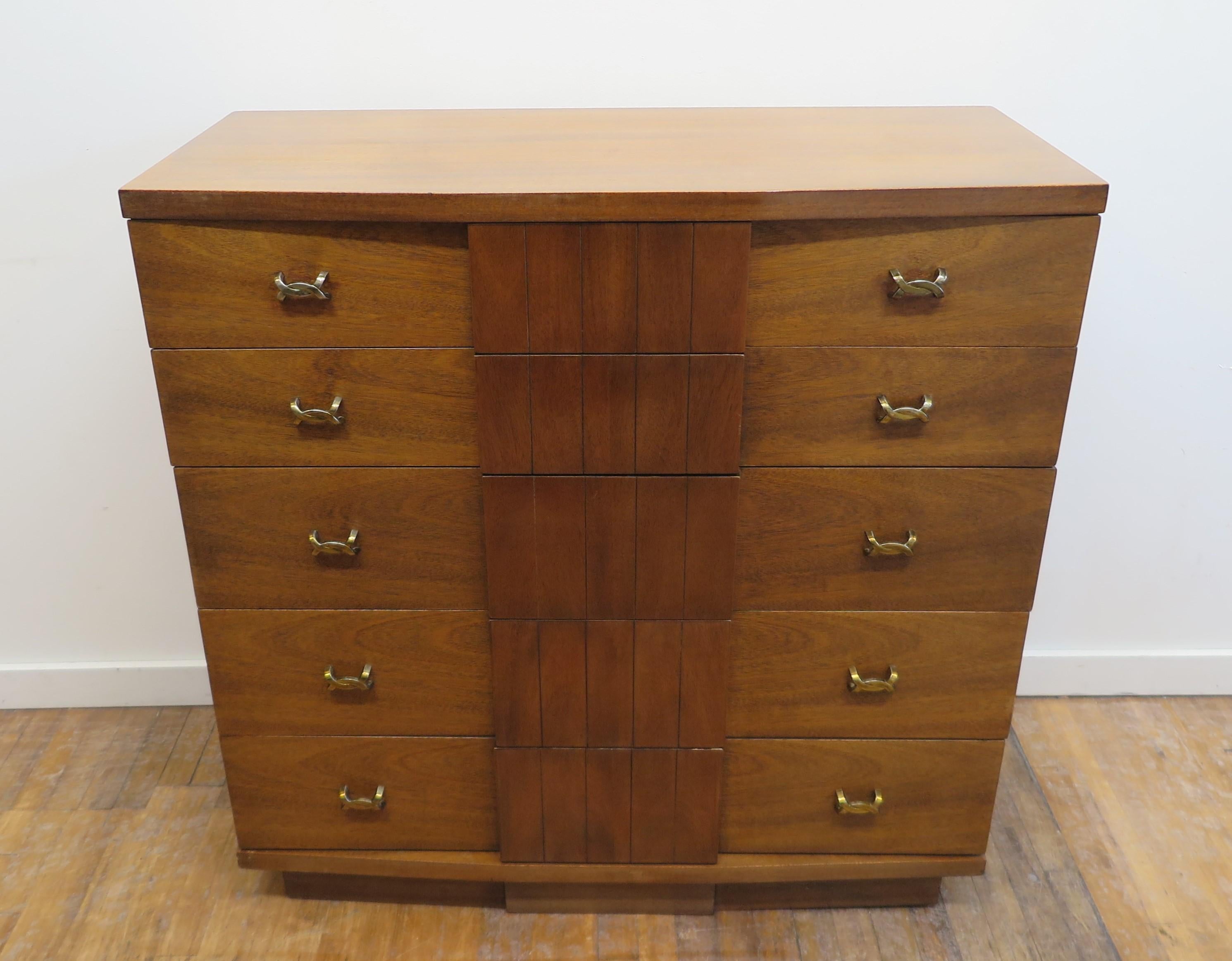 Kent Coffey highboy dresser chest of drawers. Titan mid century dresser by Kent Coffey. Five drawer mid century chest of drawers in walnut with brass detail hardware. Kent Coffey Furniture provided modernity and quality to the American market and