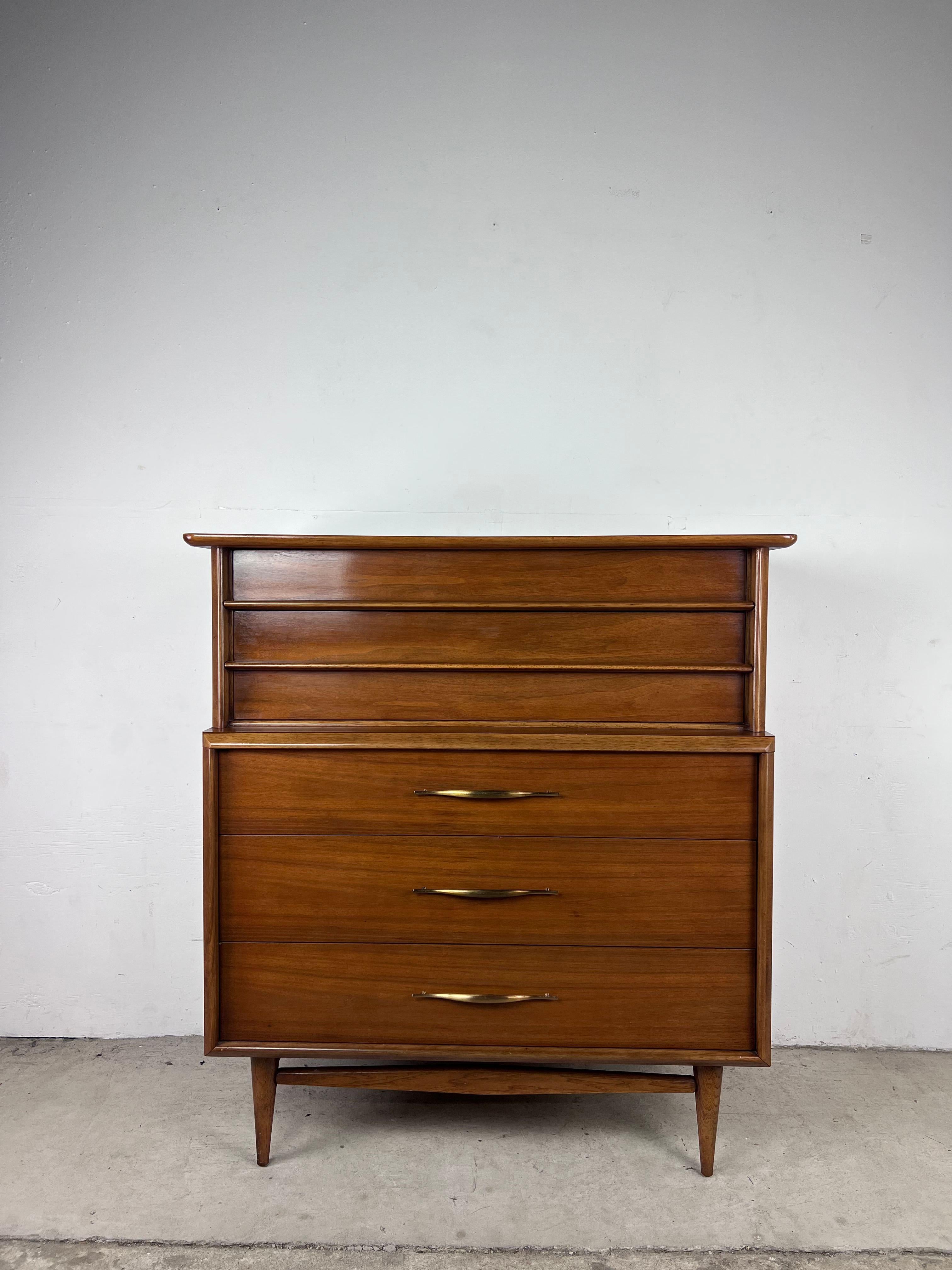 This mid century modern highboy dresser from the 
