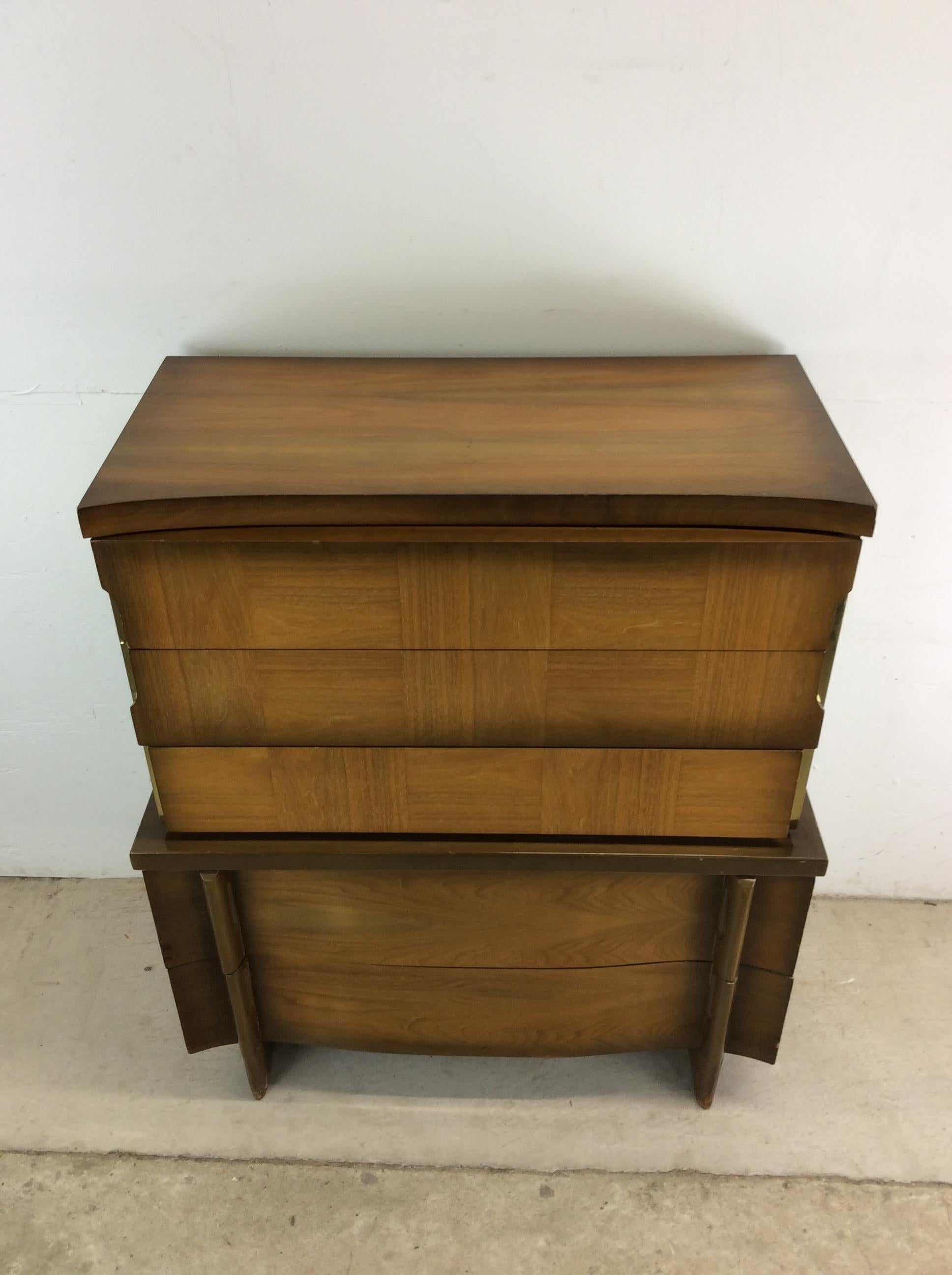 This mid century modern highboy dresser features hardwood construction, walnut veneer with original finish, five dovetailed drawers, and unique sled legs.  Matching lowboy dresser with mirror and pair of nightstands available