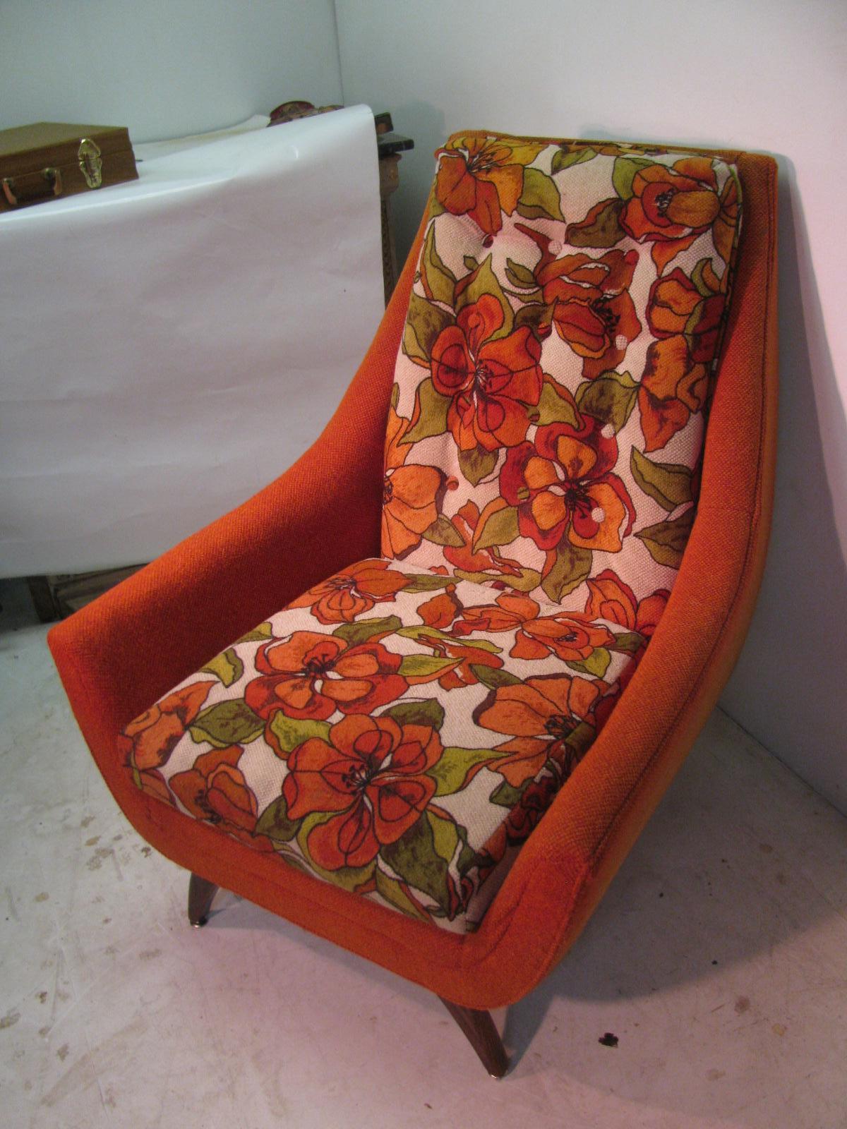 Fabulous Mid-Century Modern 3-piece set which includes his and hers lounge chairs with a ottoman. Created by Bassett Furniture in the mid-1960s. Floral cushions with an orange wool tweed which is original to the set and in exceptional condition, no