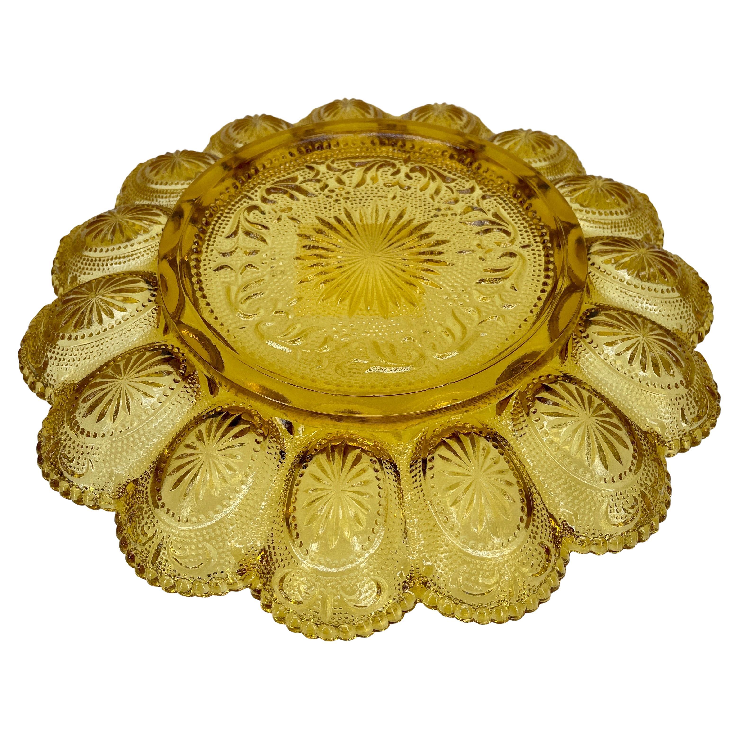 Hobnail amber glass egg or Hors d'oeuvre platter, circa 1960's. Gorgeous golden amber pressed glass plate simply glows as it presents deviled eggs or any appetizer. The scalloped edges and intricate etching make this sweet platter as beautiful as it